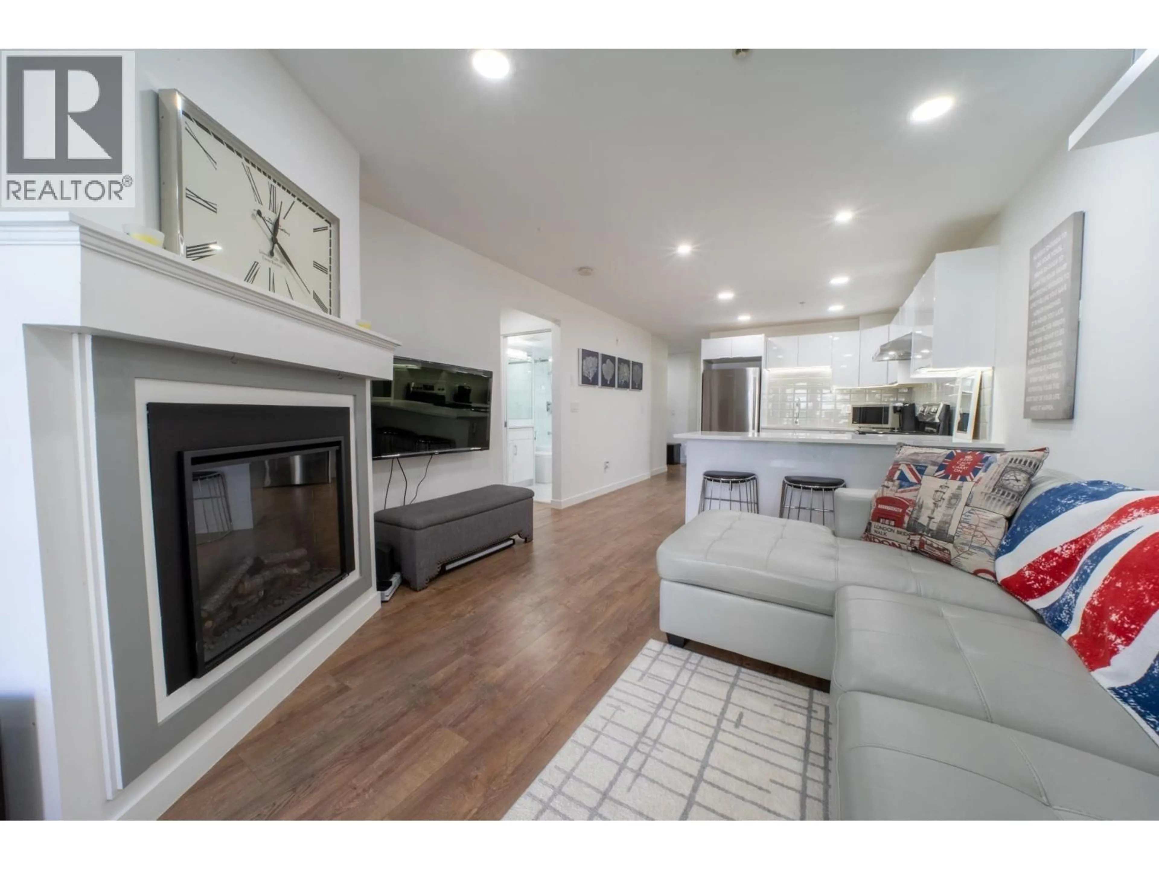 Living room with furniture, wood/laminate floor for 207 - 5025 JOYCE STREET, Vancouver British Columbia V5R4G7