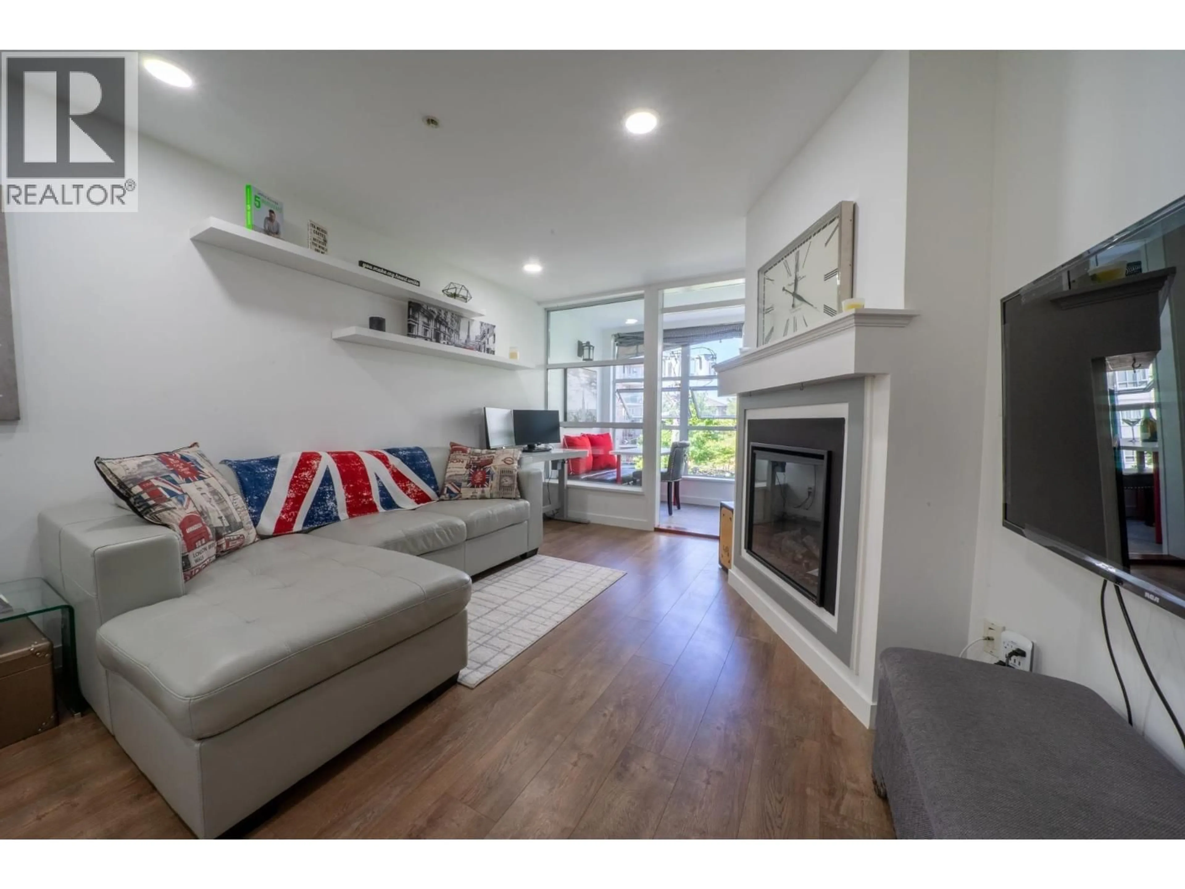 Living room with furniture, wood/laminate floor for 207 - 5025 JOYCE STREET, Vancouver British Columbia V5R4G7