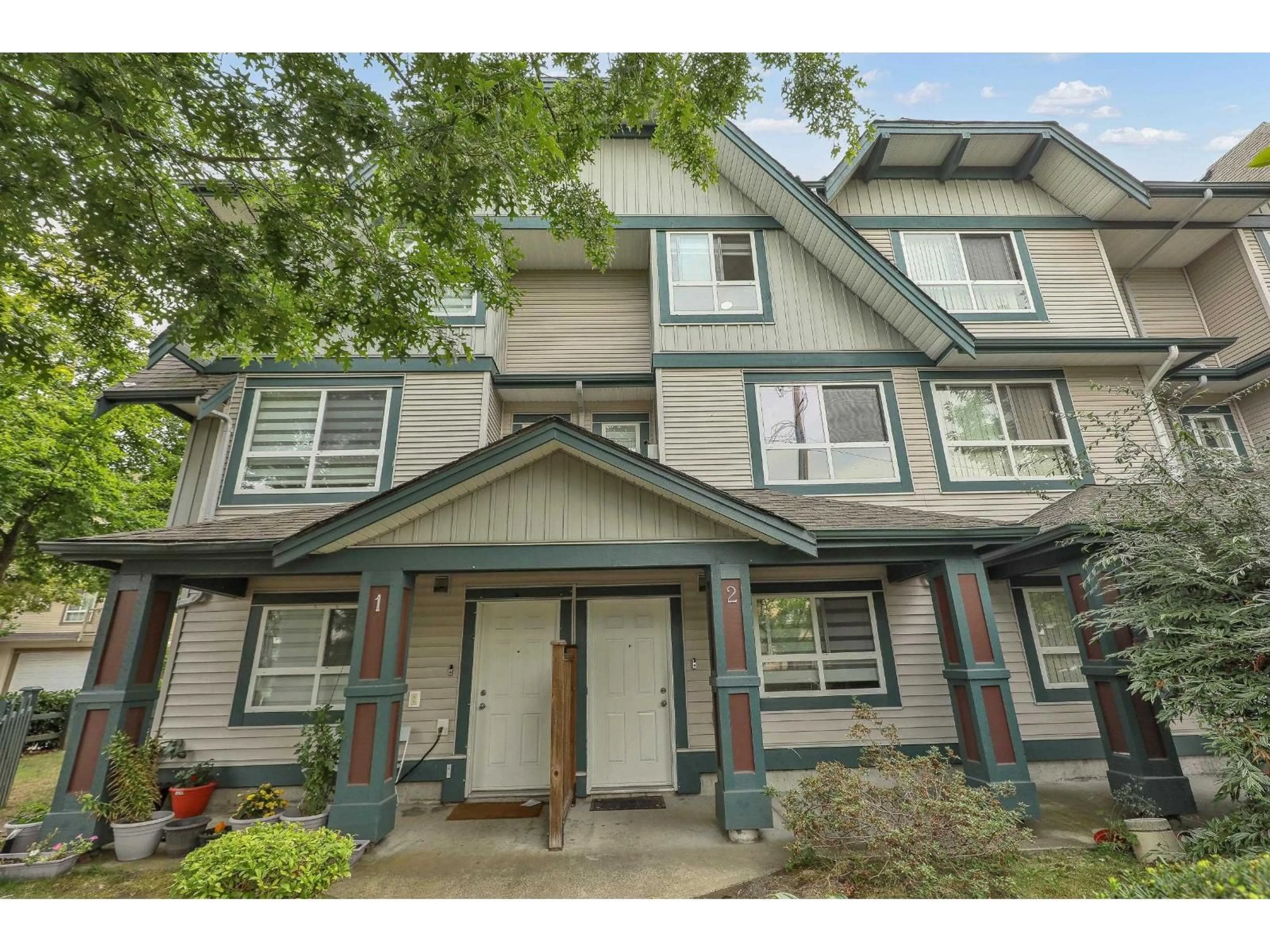 Home with vinyl exterior material, street for 2 - 12730 66, Surrey British Columbia V3W1P2