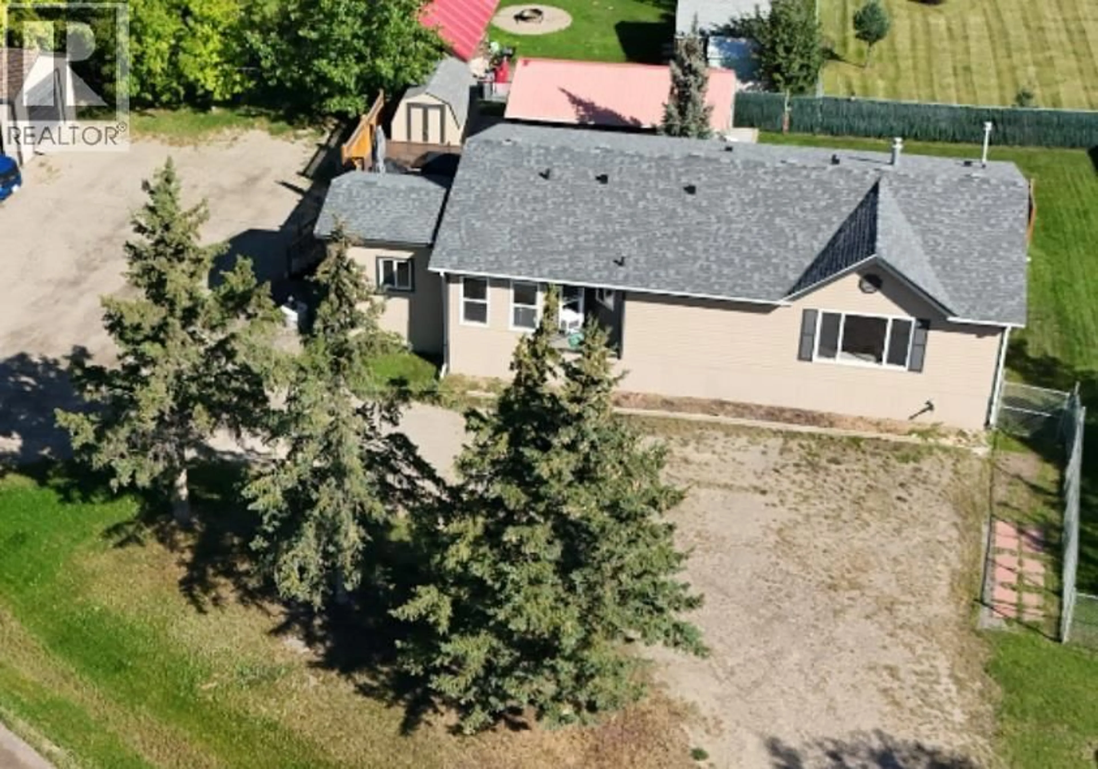 A pic from outside/outdoor area/front of a property/back of a property/a pic from drone, unknown for 11402 POPLAR ROAD, Fort St. John British Columbia V1J4M7