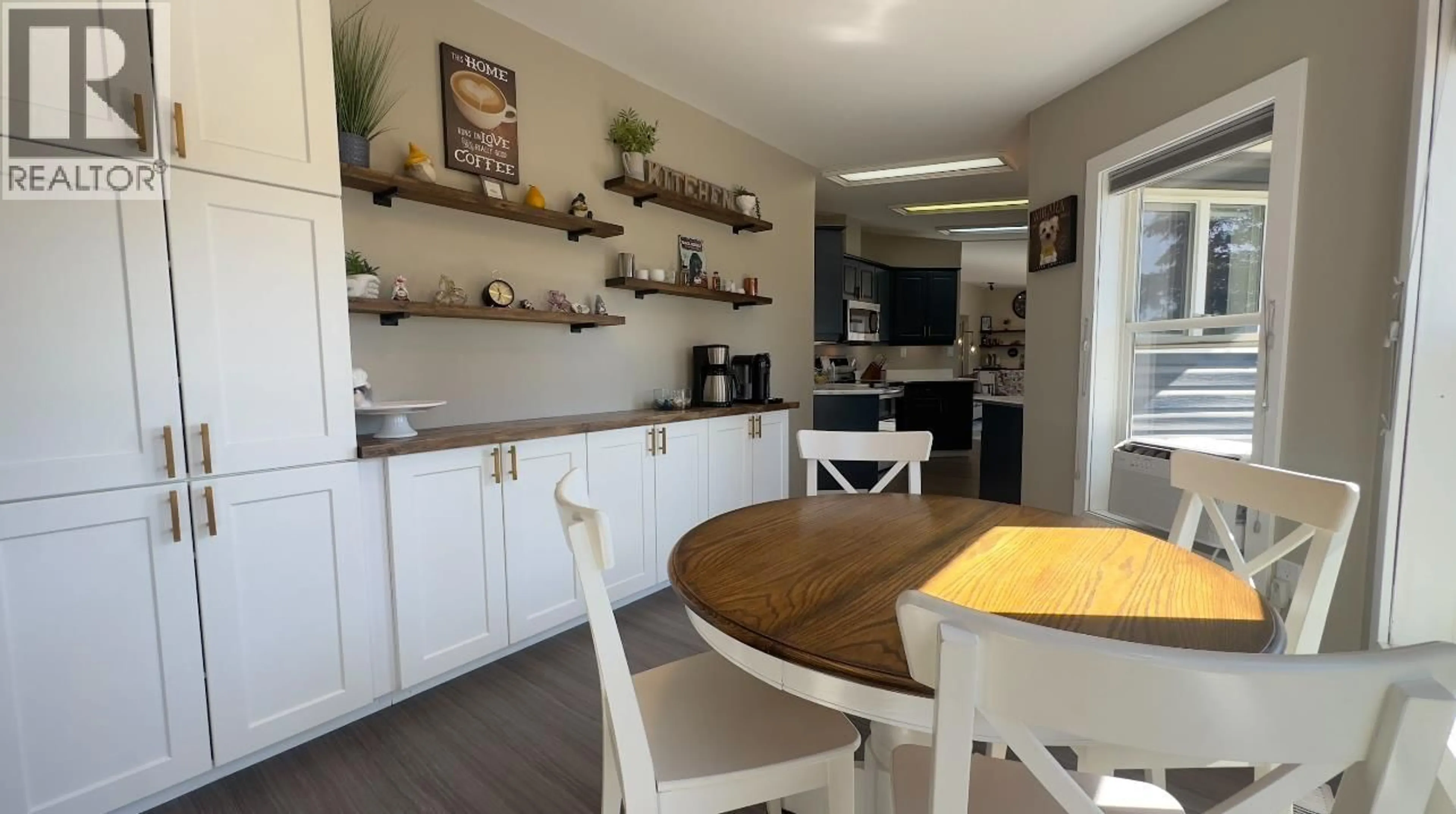 Open concept kitchen, wood/laminate floor for 11402 POPLAR ROAD, Fort St. John British Columbia V1J4M7