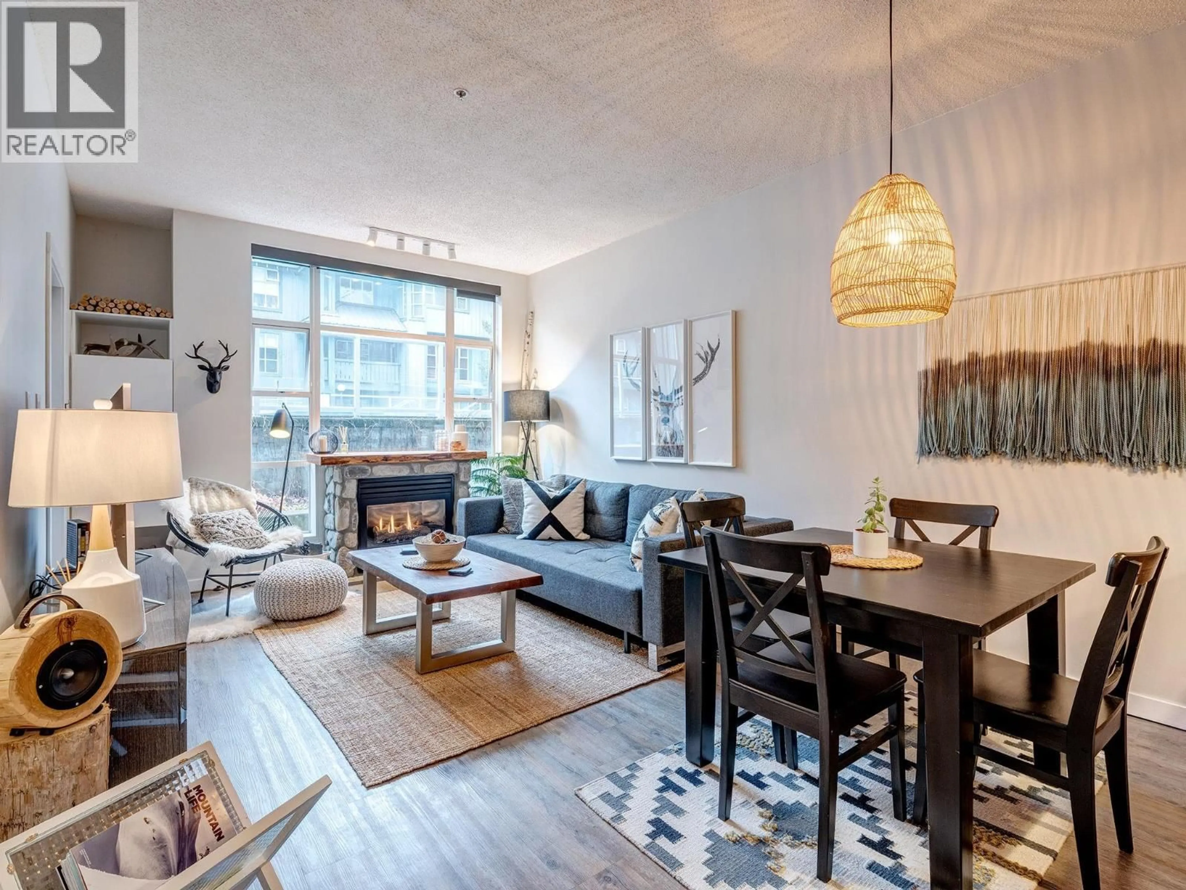 Living room with furniture, wood/laminate floor for 104 - 4573 CHATEAU BOULEVARD, Whistler British Columbia V8E0Z5