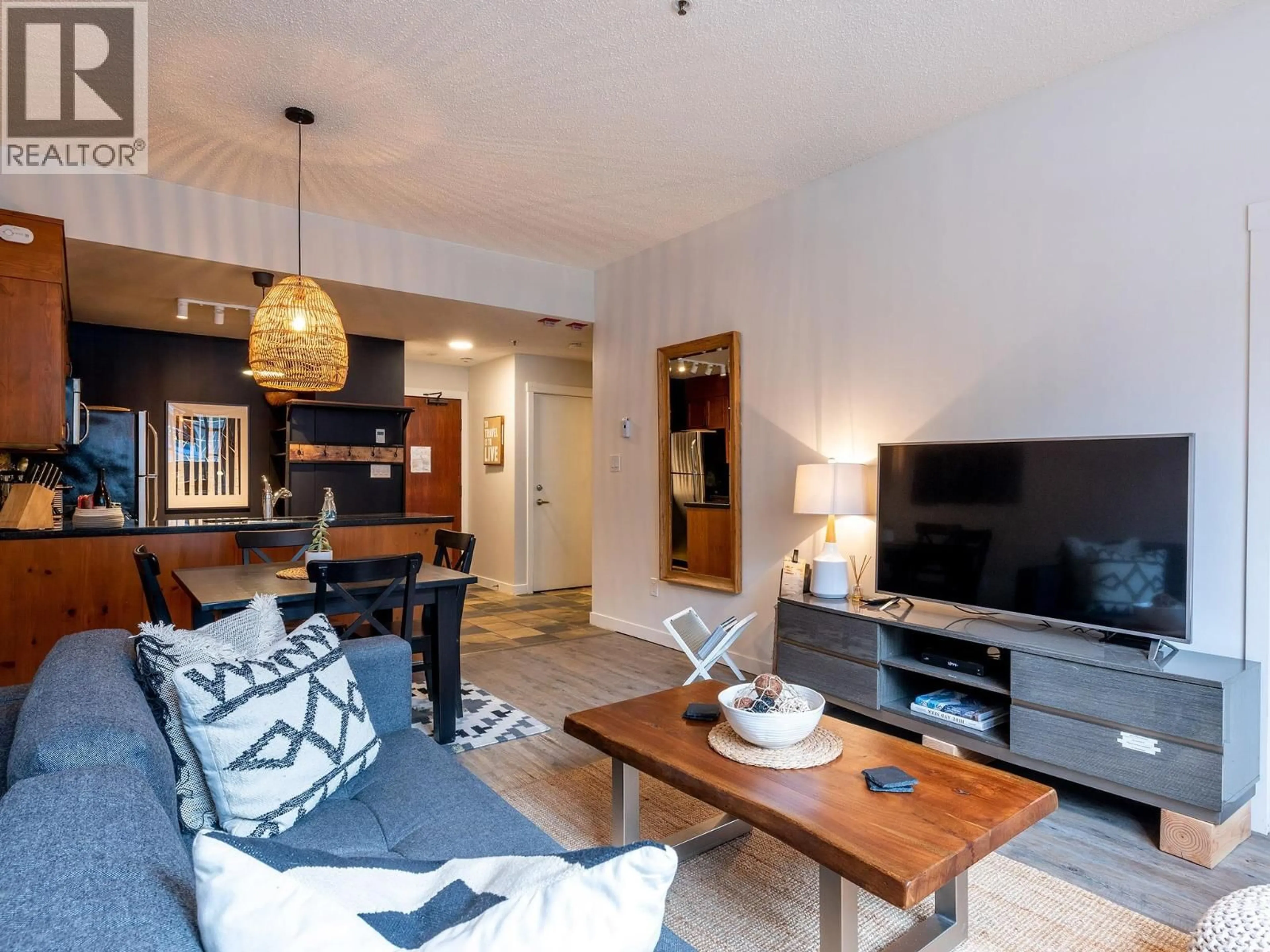Living room with furniture, wood/laminate floor for 104 - 4573 CHATEAU BOULEVARD, Whistler British Columbia V8E0Z5