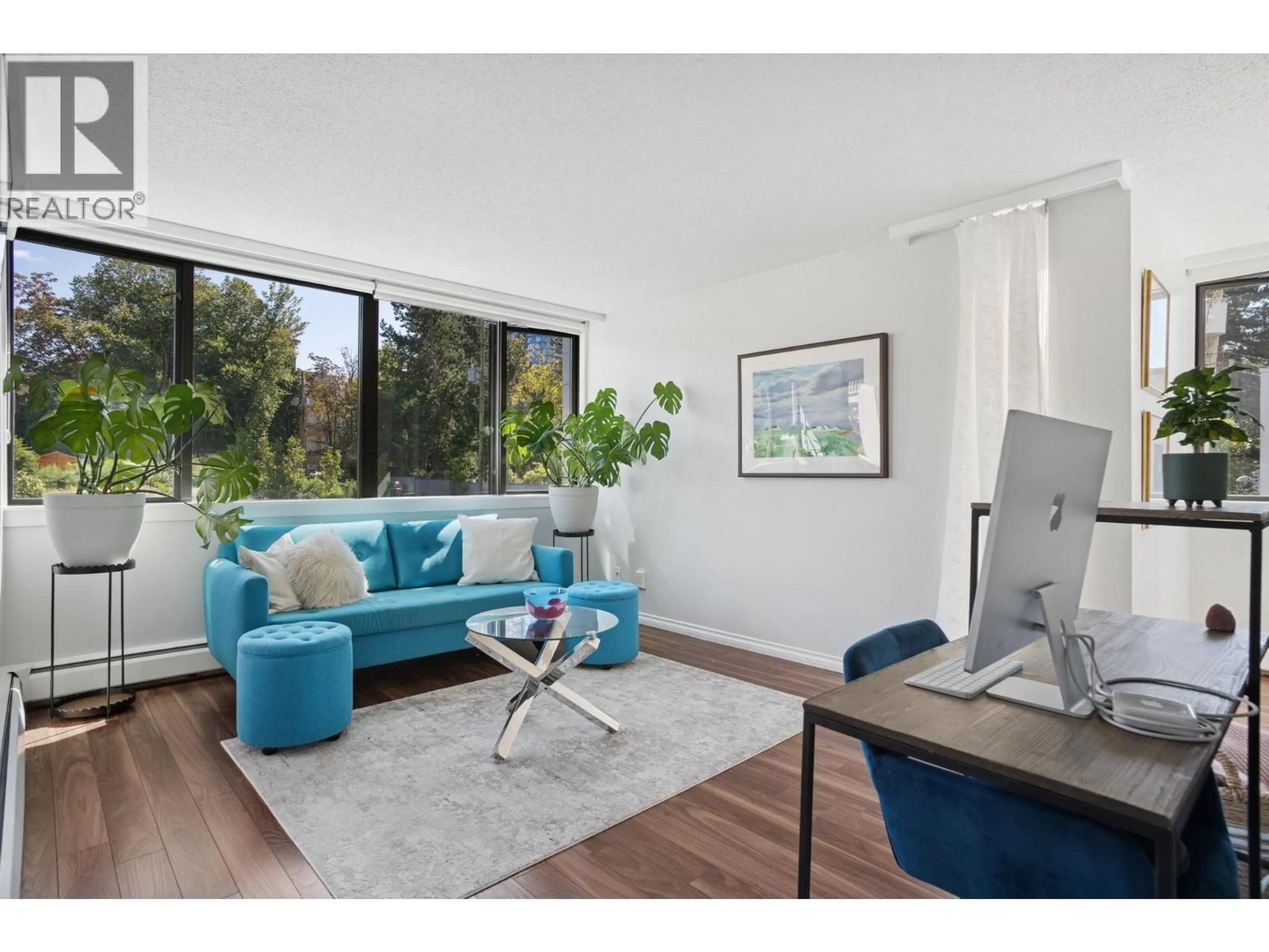 Living room with furniture, wood/laminate floor for 206 - 1740 COMOX STREET, Vancouver British Columbia V6G2Z1