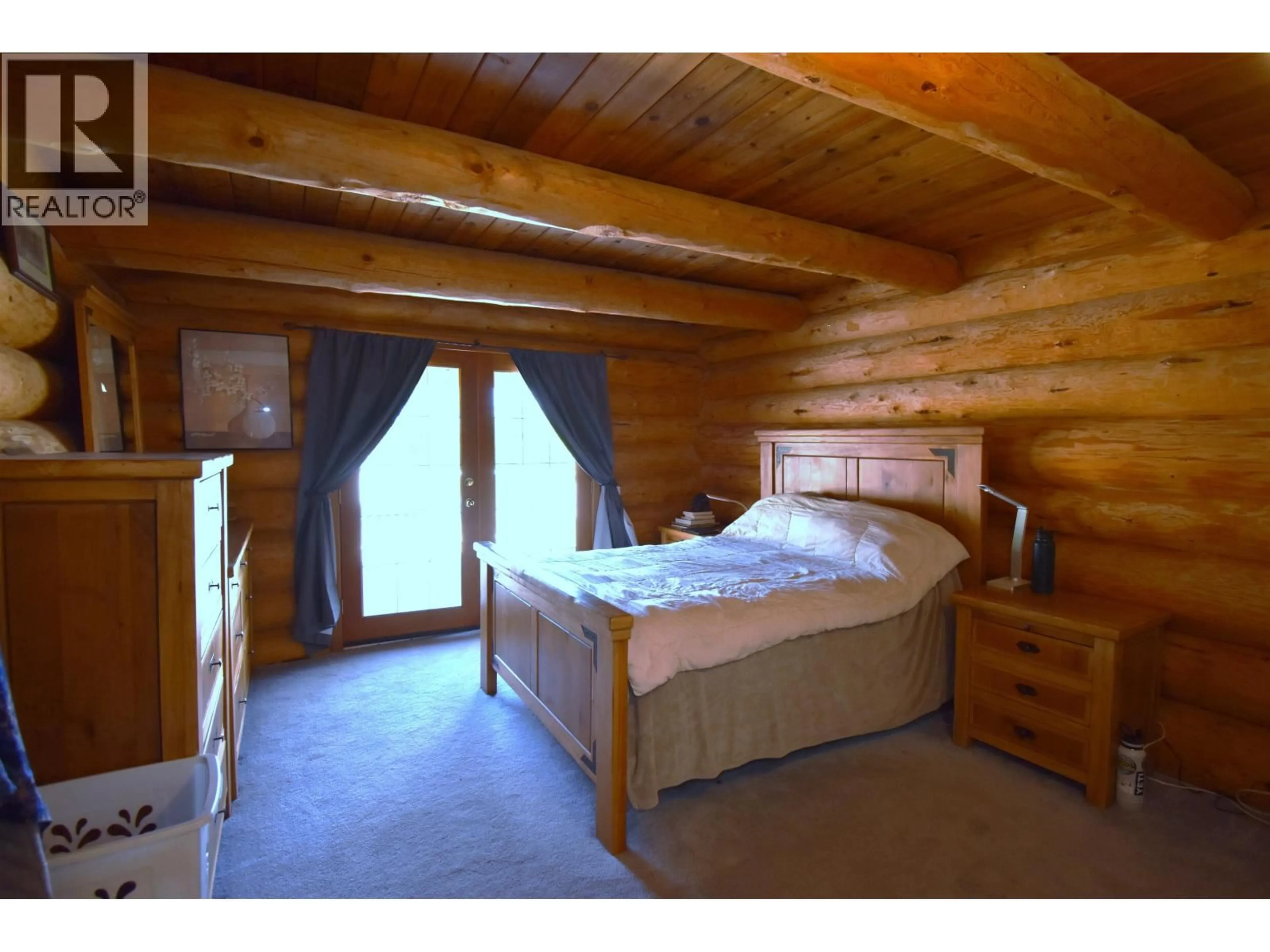 Bedroom with bed, wood/laminate floor for 1310 WILLOW STREET, Telkwa British Columbia V0J2X0