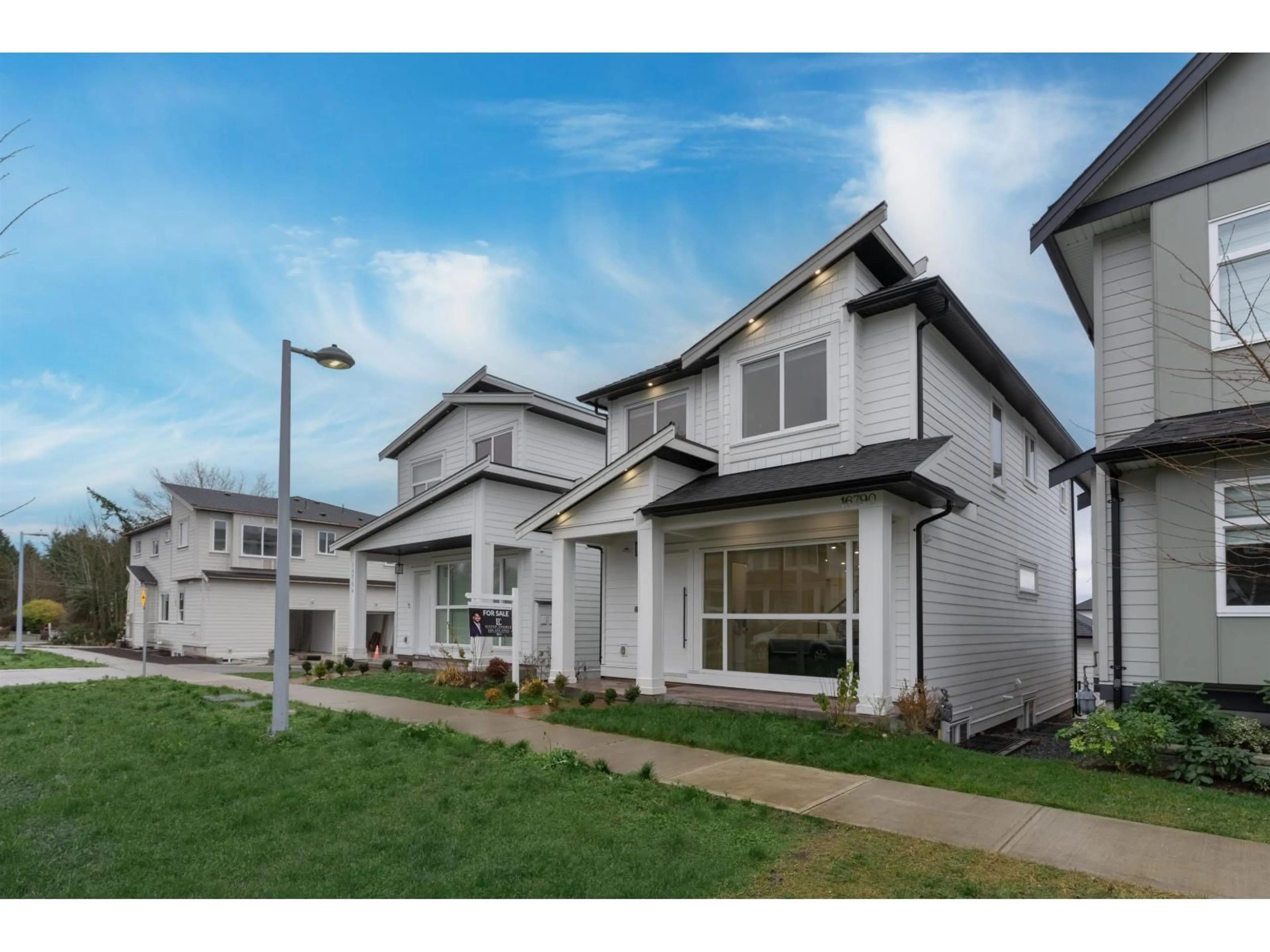 Home with vinyl exterior material, street for 16790 20A, Surrey British Columbia V3Z1H1