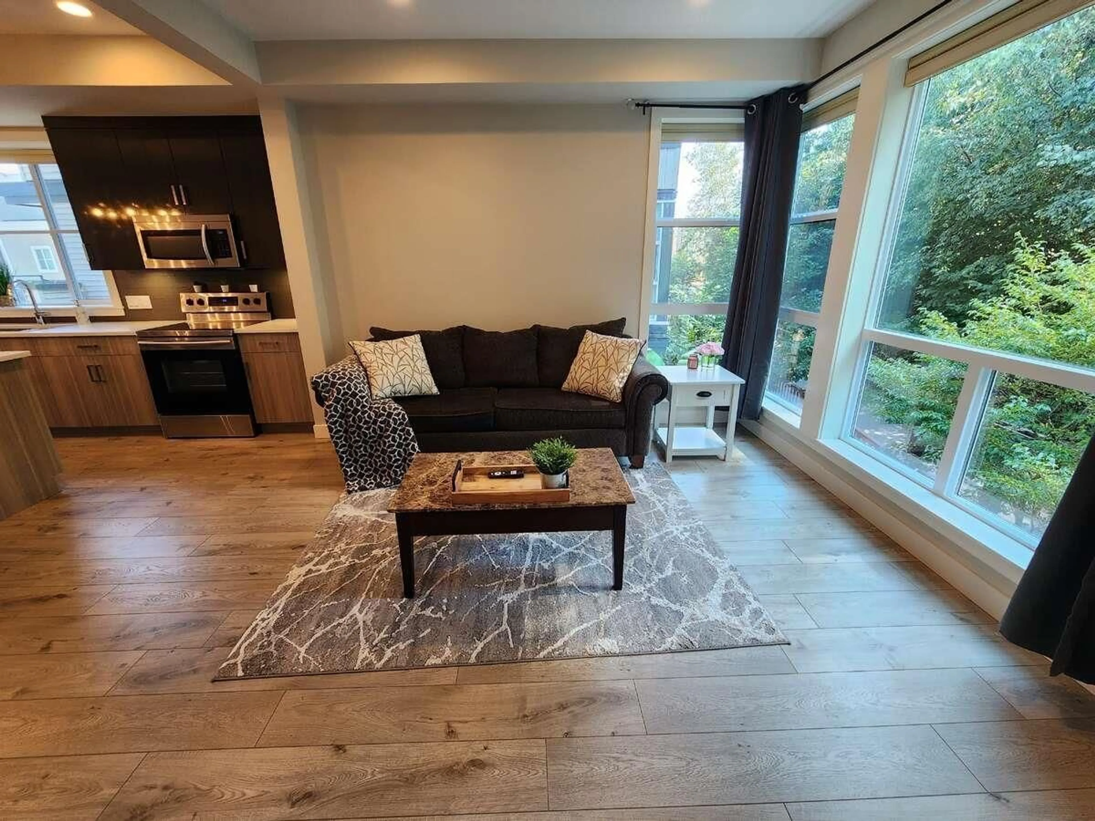 Living room with furniture, wood/laminate floor for 51 - 8413 MIDTOWN WAY, Chilliwack British Columbia V2P0G7