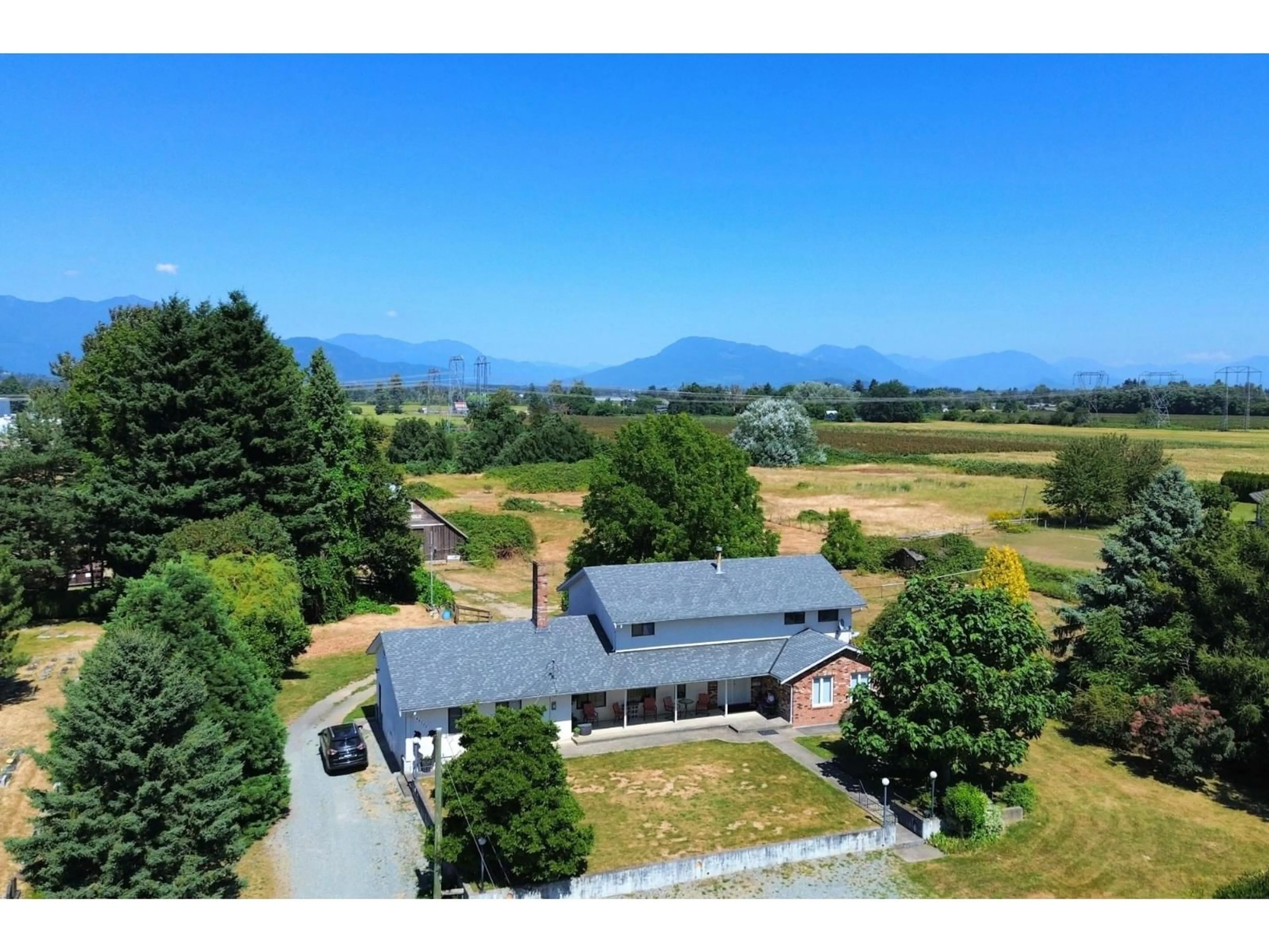A pic from outside/outdoor area/front of a property/back of a property/a pic from drone, mountain view for 44705 WATSON ROAD, Chilliwack British Columbia V2R2Y6