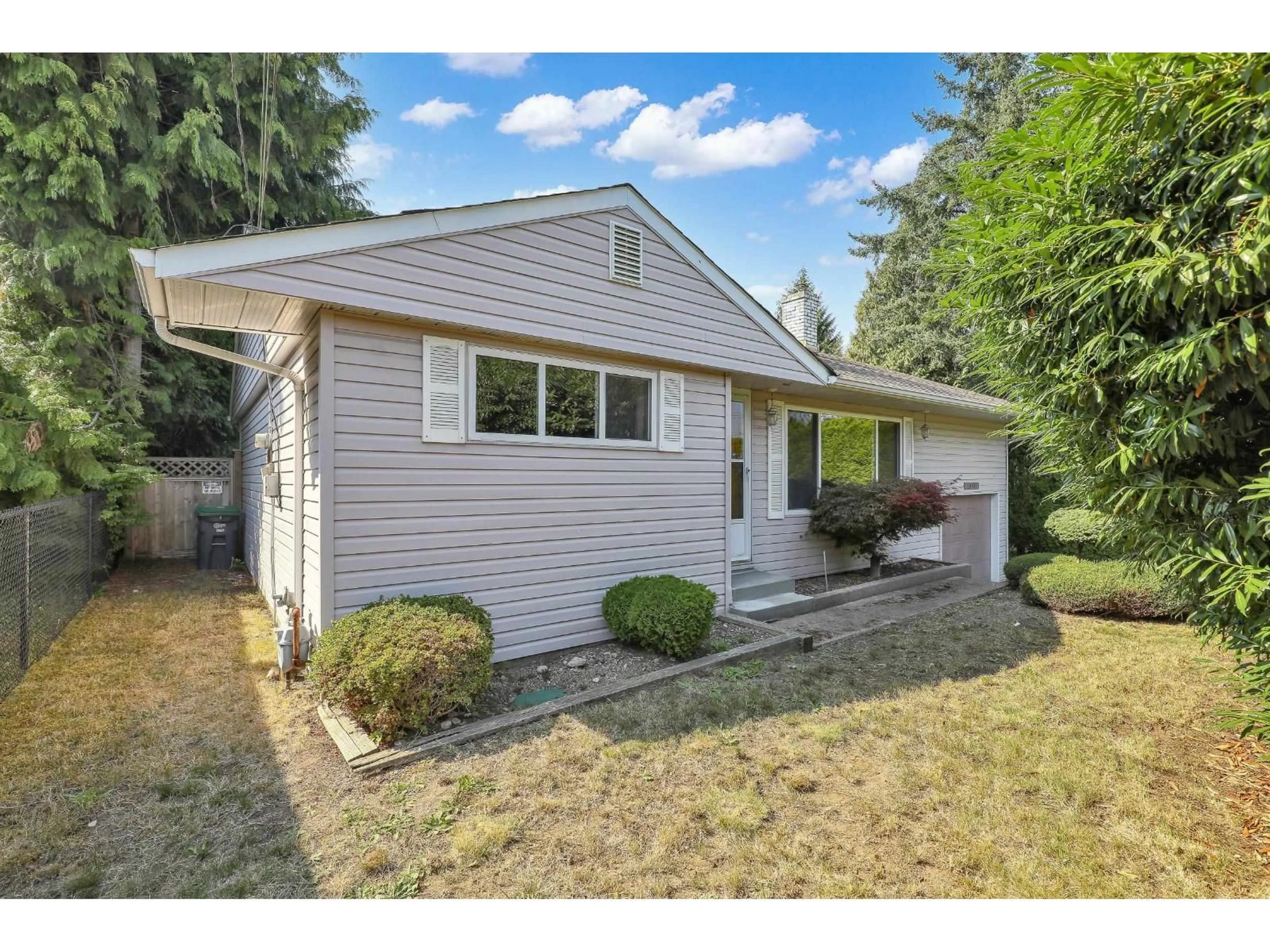 Home with vinyl exterior material, street for 10983 132, Surrey British Columbia V3T3W8