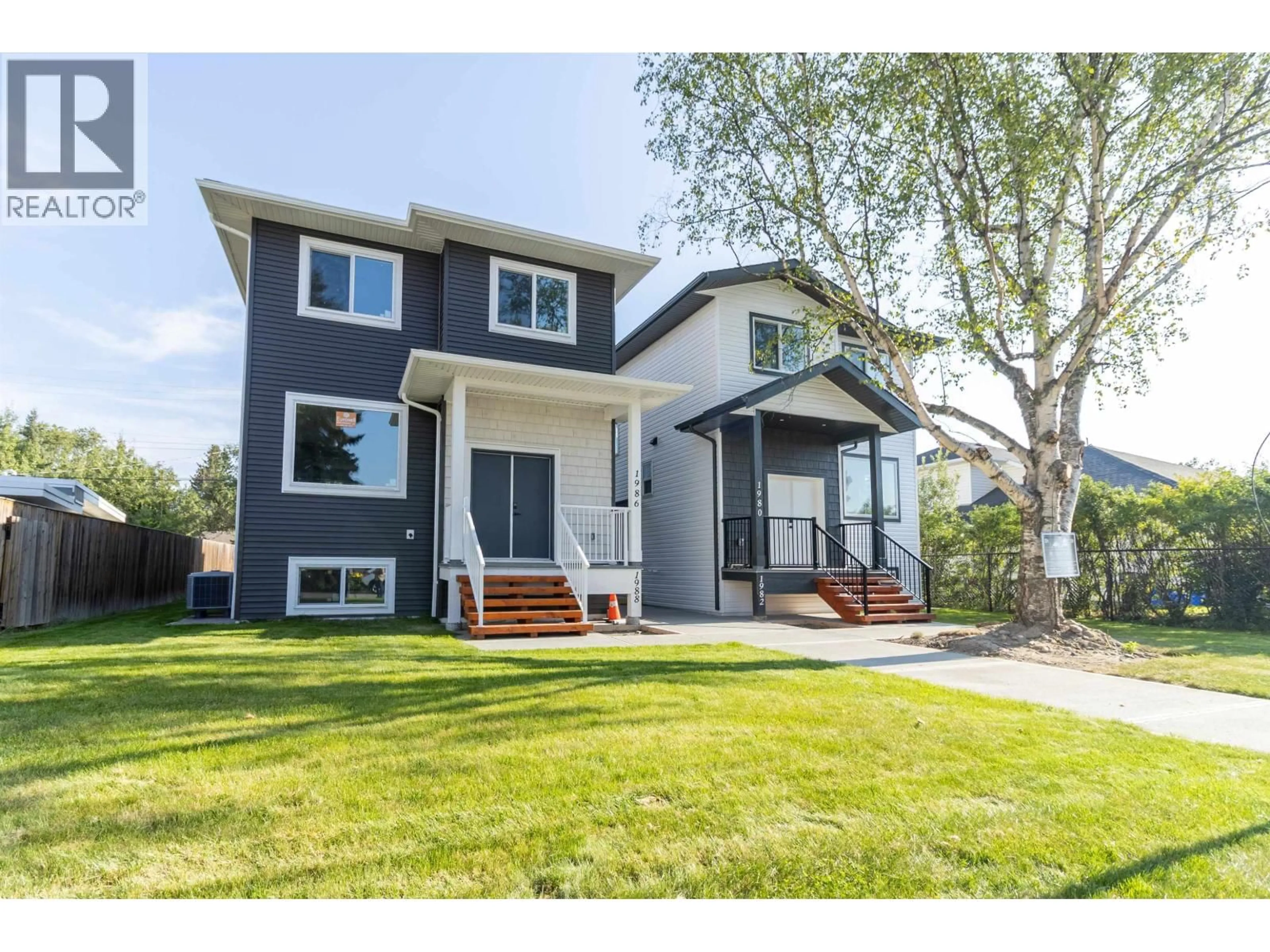Home with vinyl exterior material, street for 1988 12TH AVENUE, Prince George British Columbia V2M1P9