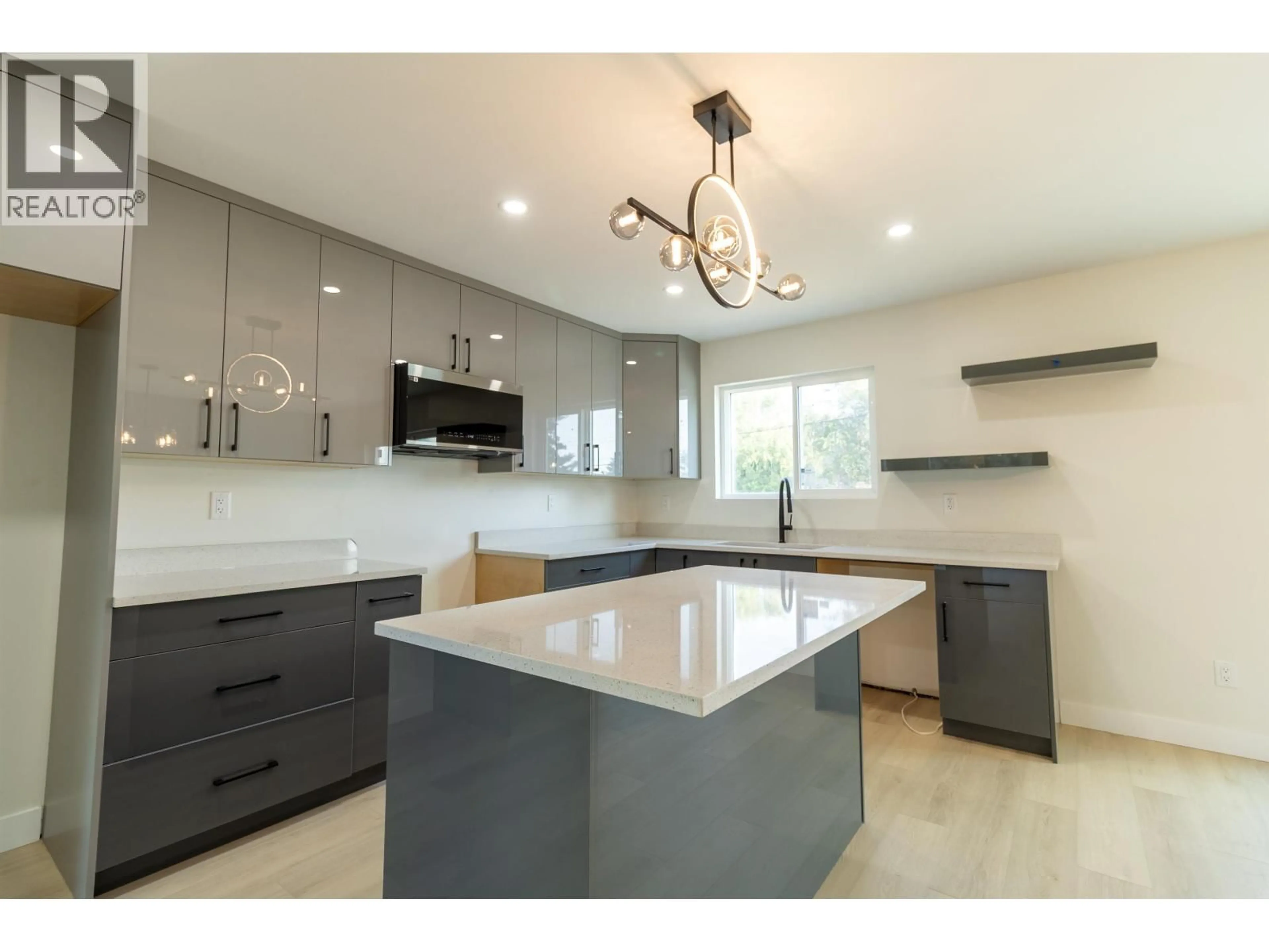 Open concept kitchen, ceramic/tile floor for 1988 12TH AVENUE, Prince George British Columbia V2M1P9