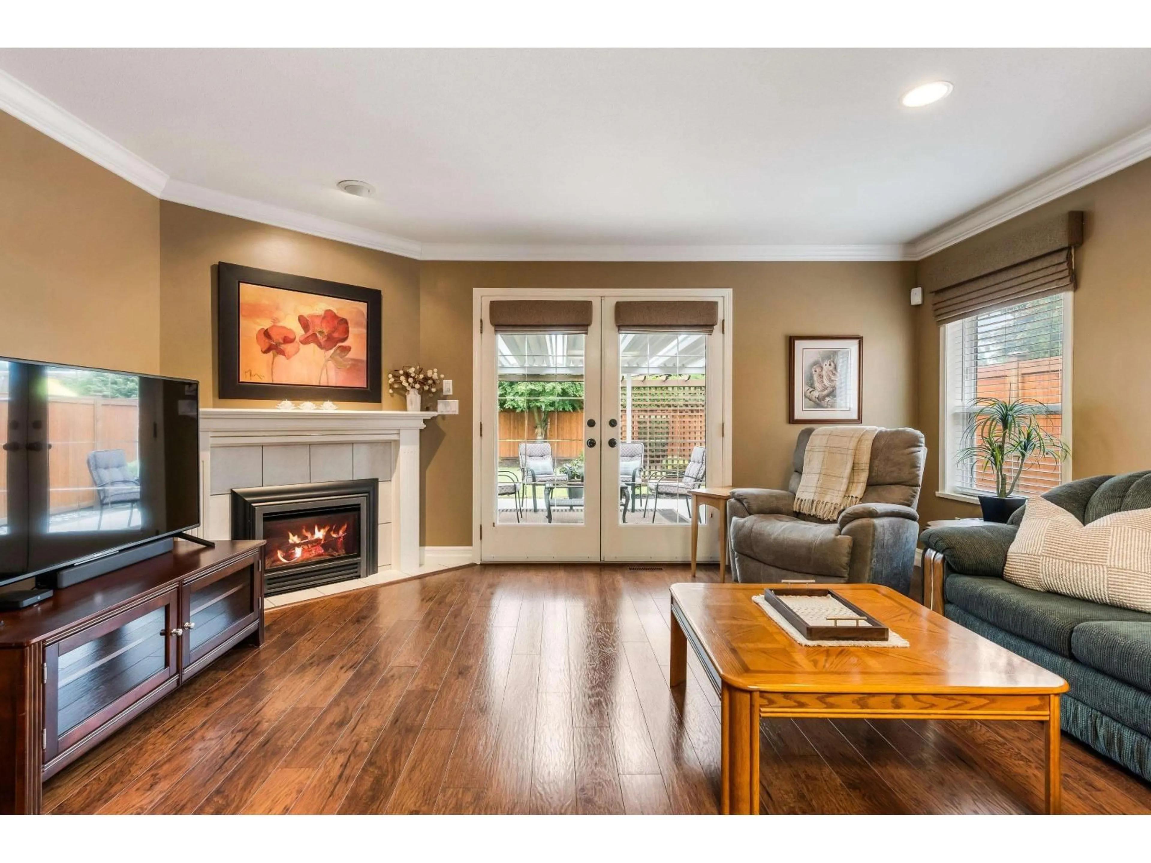 Living room with furniture, wood/laminate floor for 10064 MERRITT DRIVE, Chilliwack British Columbia V2P7Z2