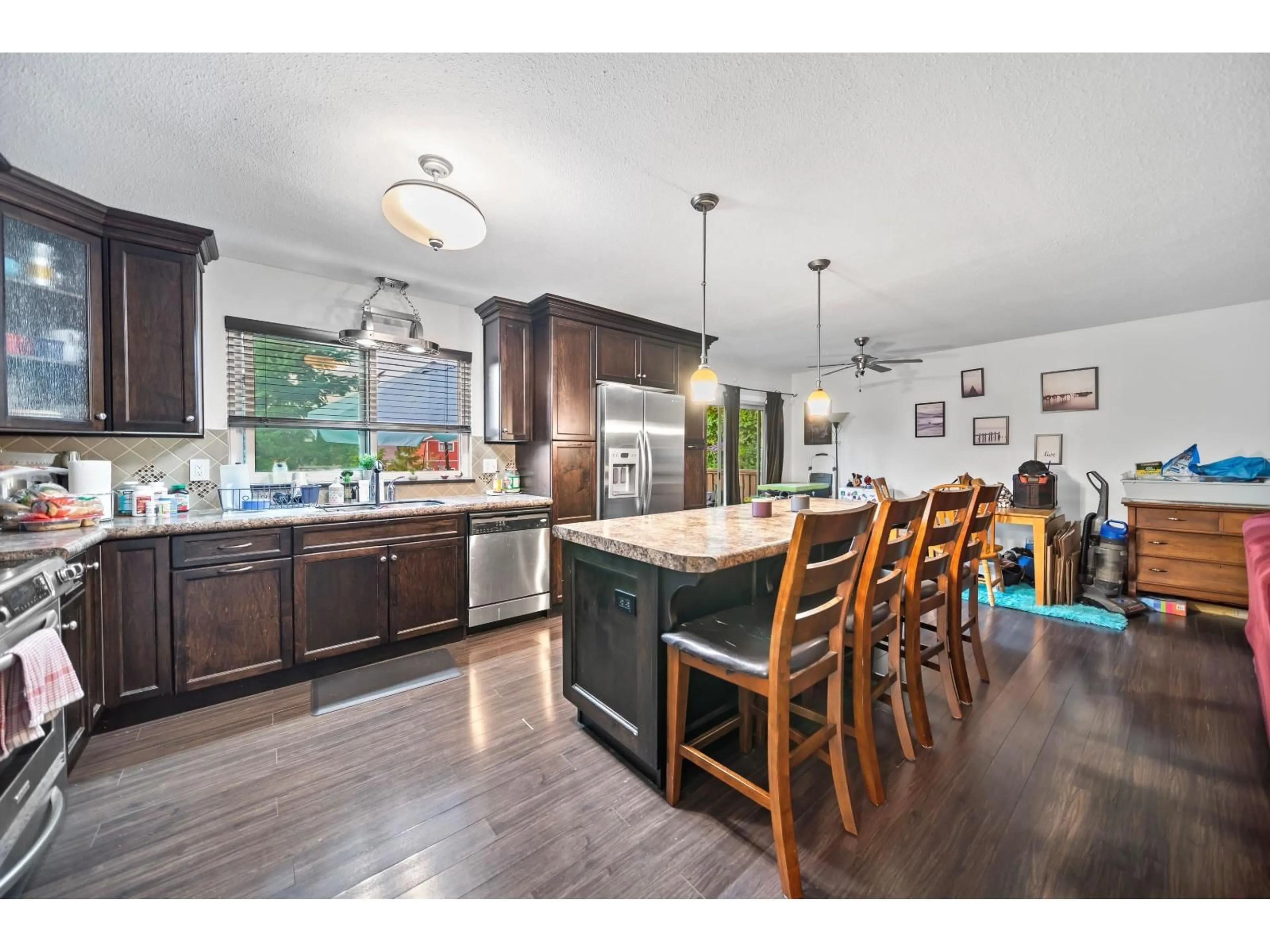 Open concept kitchen, wood/laminate floor for 33943 PINE, Abbotsford British Columbia V2S2P4