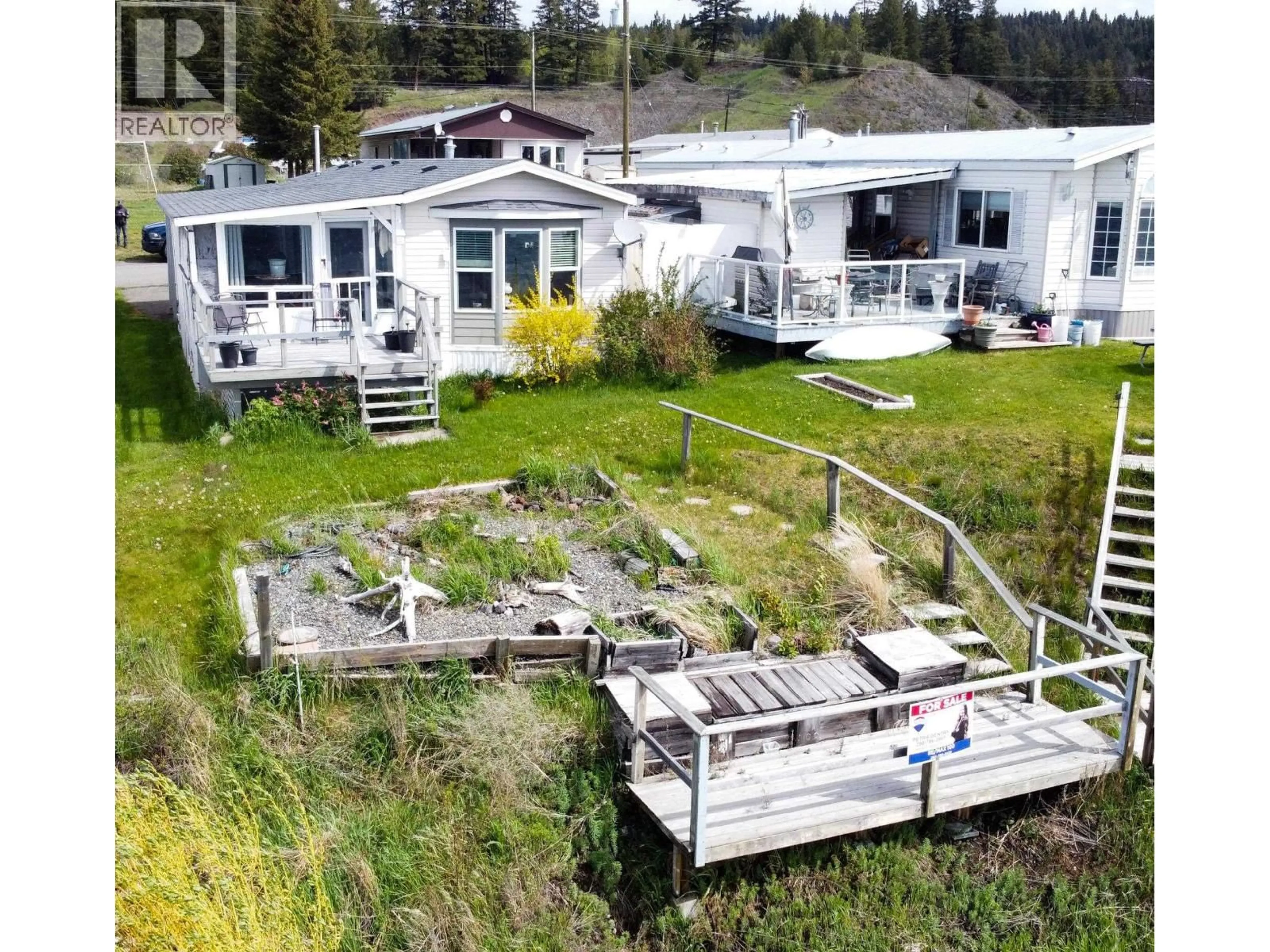 A pic from outside/outdoor area/front of a property/back of a property/a pic from drone, water/lake/river/ocean view for 5-3728 S CARIBOO HIGHWAY, Lac La Hache British Columbia V0K1T1