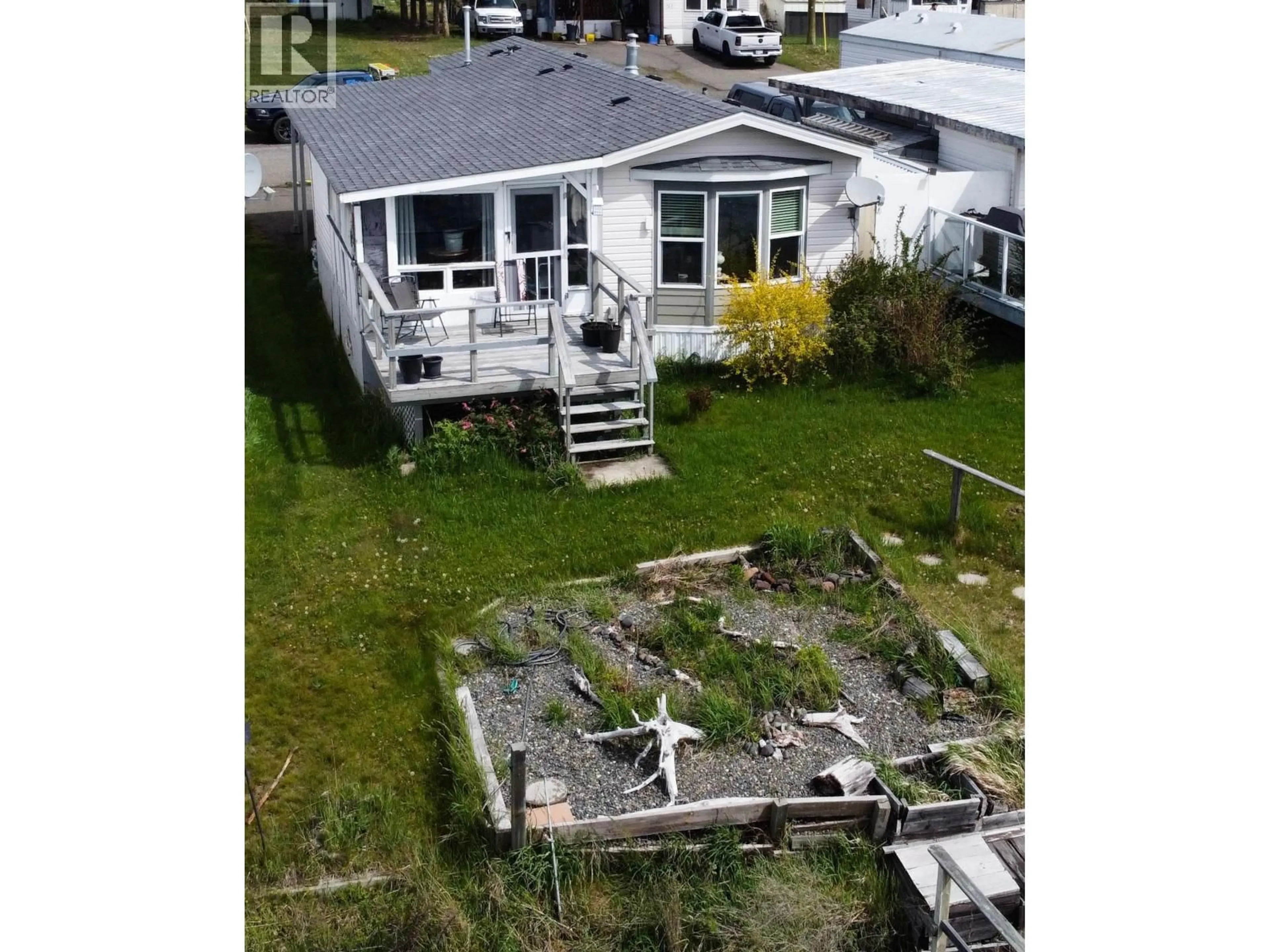 A pic from outside/outdoor area/front of a property/back of a property/a pic from drone, water/lake/river/ocean view for 5-3728 S CARIBOO HIGHWAY, Lac La Hache British Columbia V0K1T1