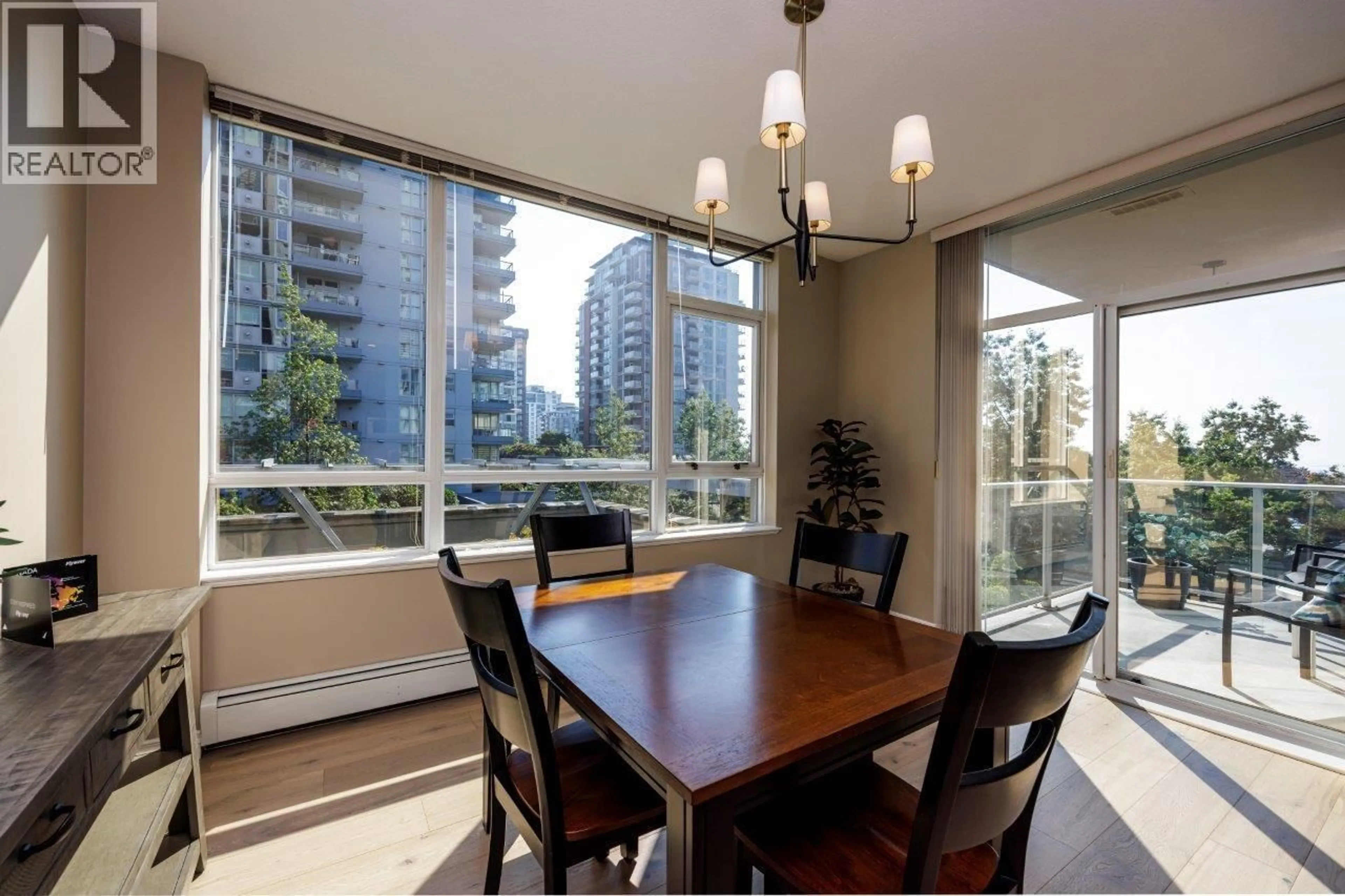 Dining room, wood/laminate floor for 301 - 120 16TH STREET, North Vancouver British Columbia V7M3N6