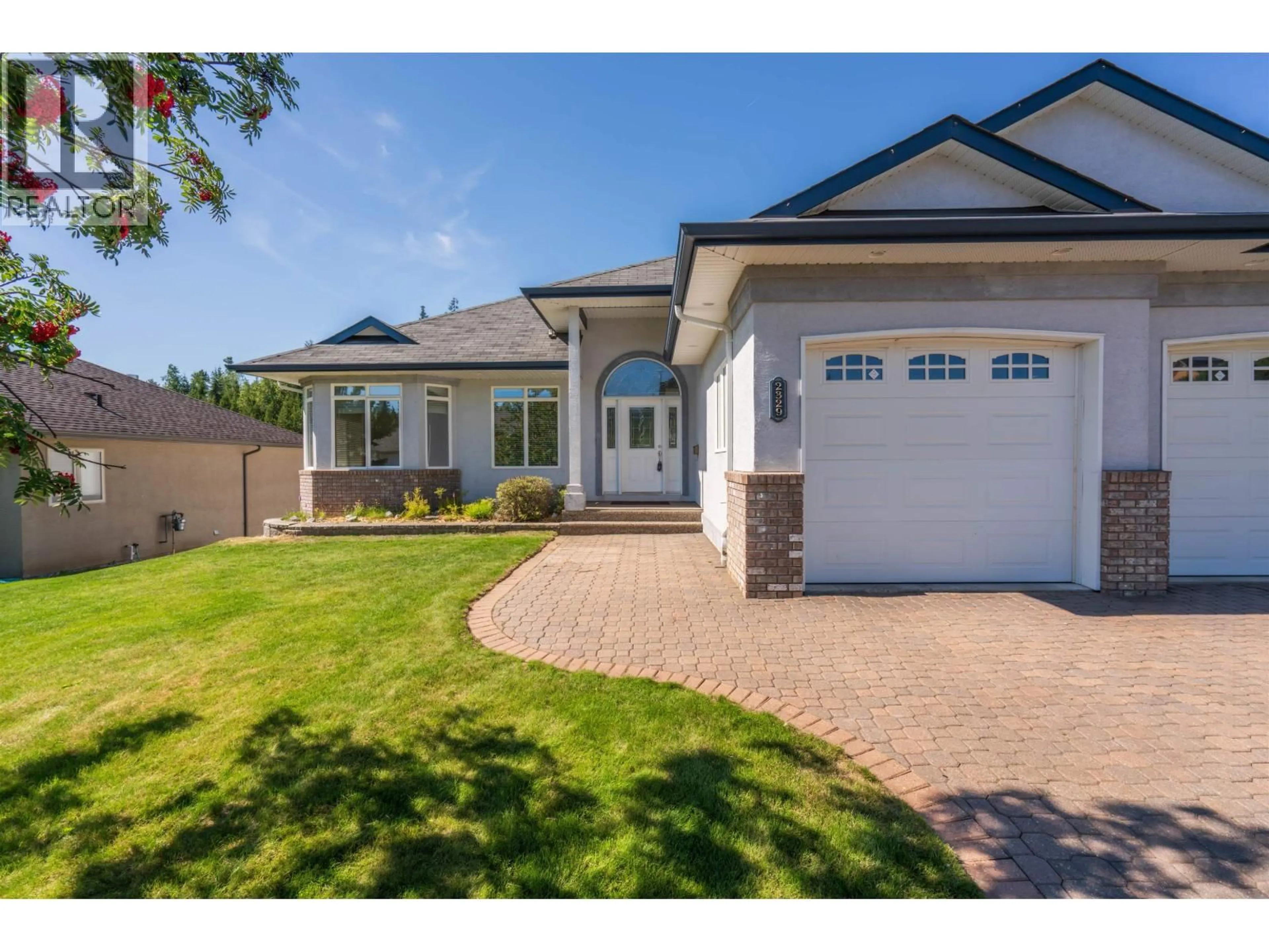 Home with brick exterior material, street for 2329 MCTAVISH ROAD, Prince George British Columbia V2K5R5