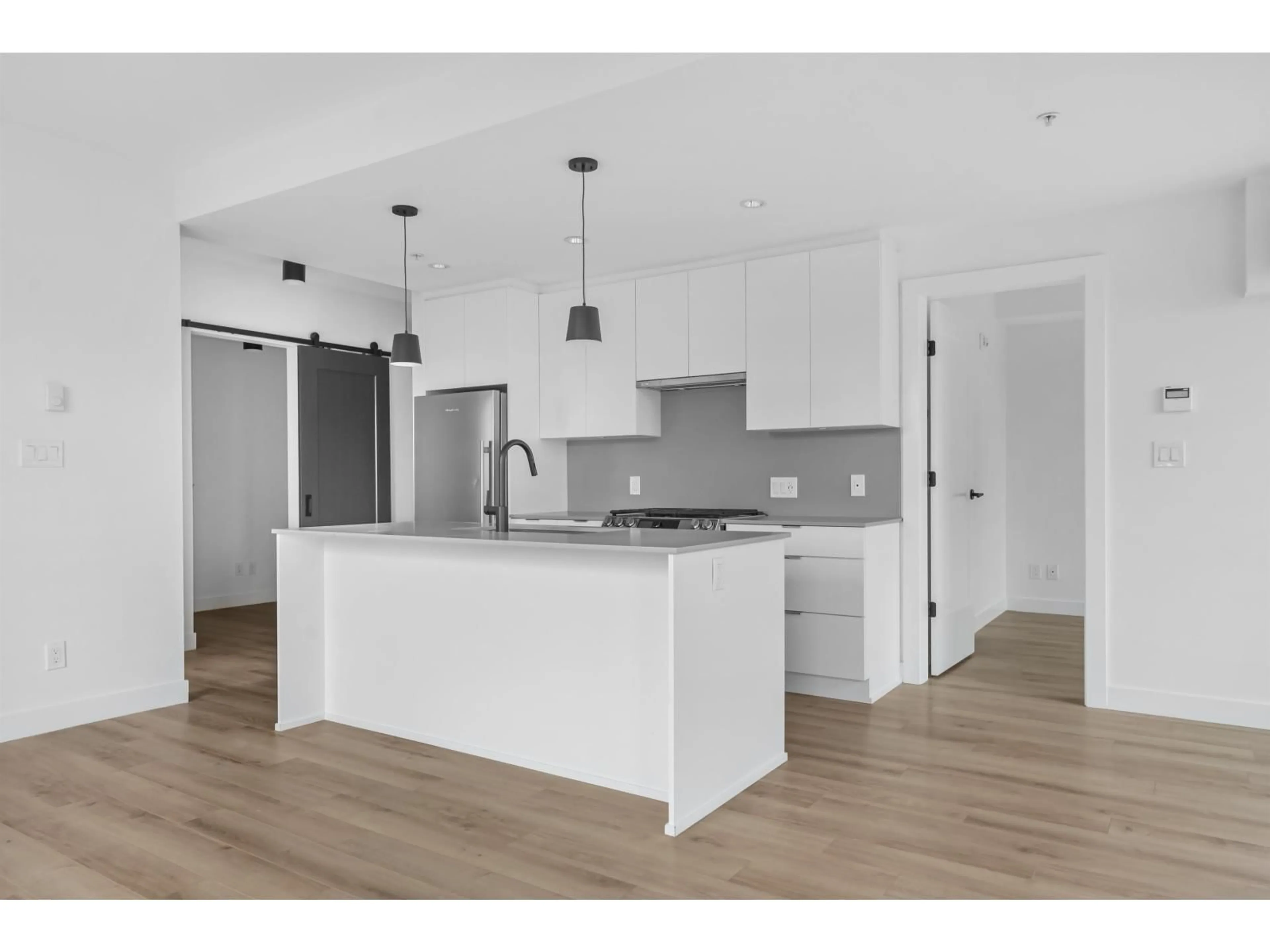 Open concept kitchen, wood/laminate floor for 318 - 2493 MONTROSE, Abbotsford British Columbia V2S0L4