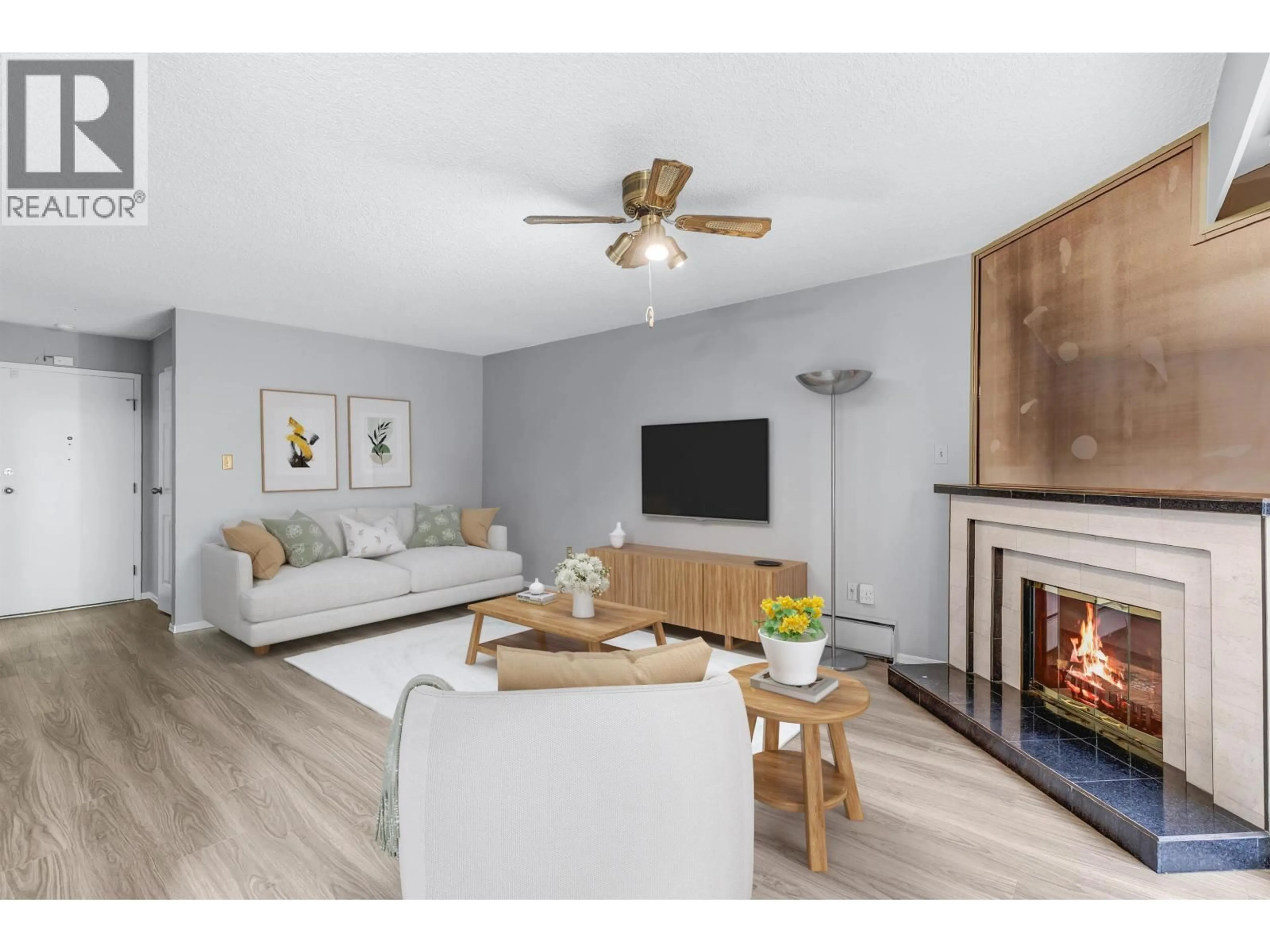 Living room with furniture, wood/laminate floor for 3901 CARRIGAN COURT, Burnaby British Columbia V3N4K1