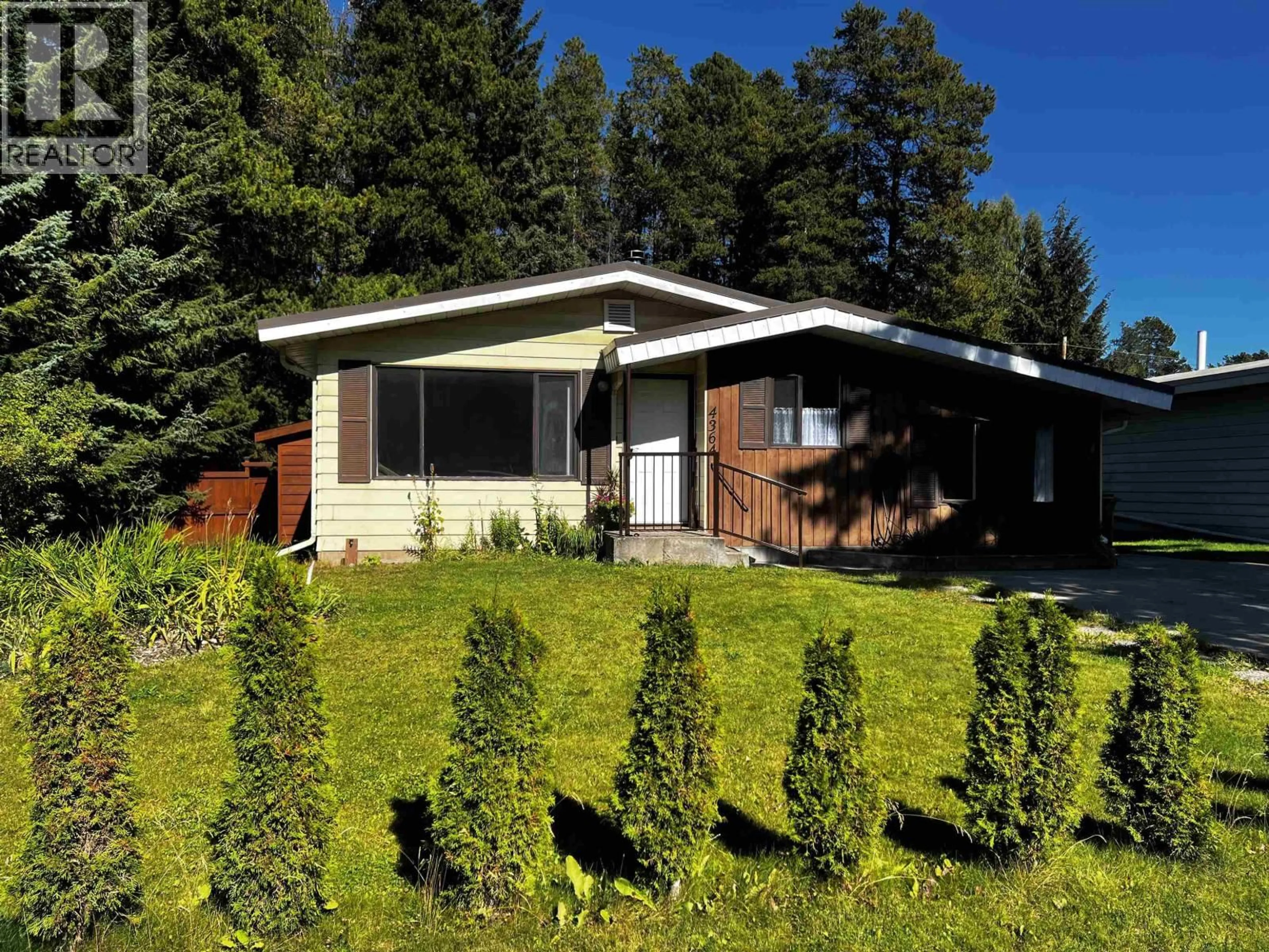 Home with vinyl exterior material, street for 4364 3RD AVENUE, Smithers British Columbia V0J2N0