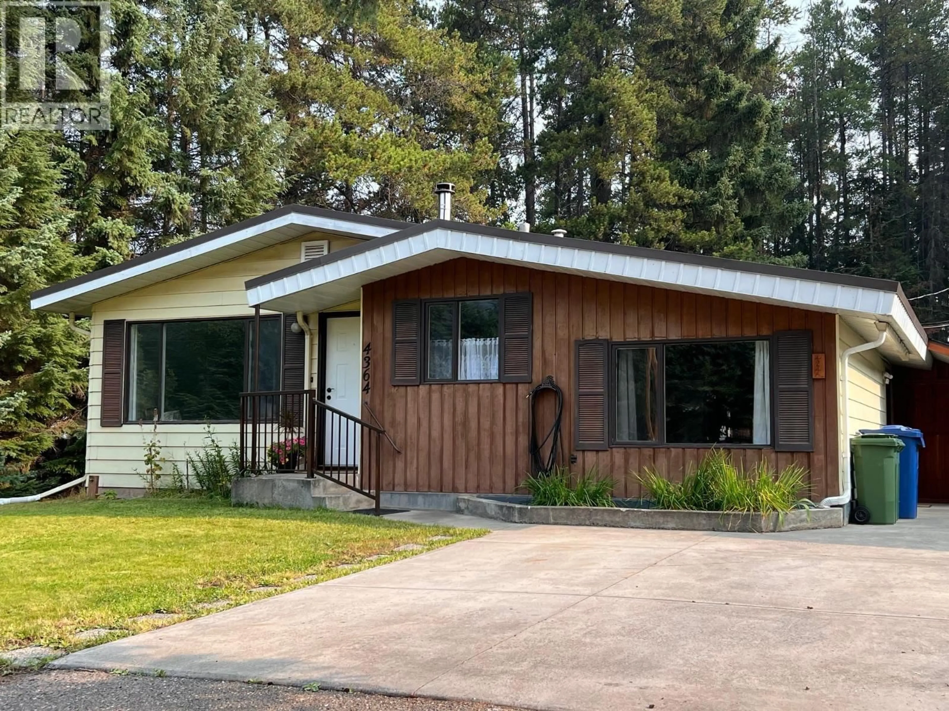 Home with vinyl exterior material, street for 4364 3RD AVENUE, Smithers British Columbia V0J2N0