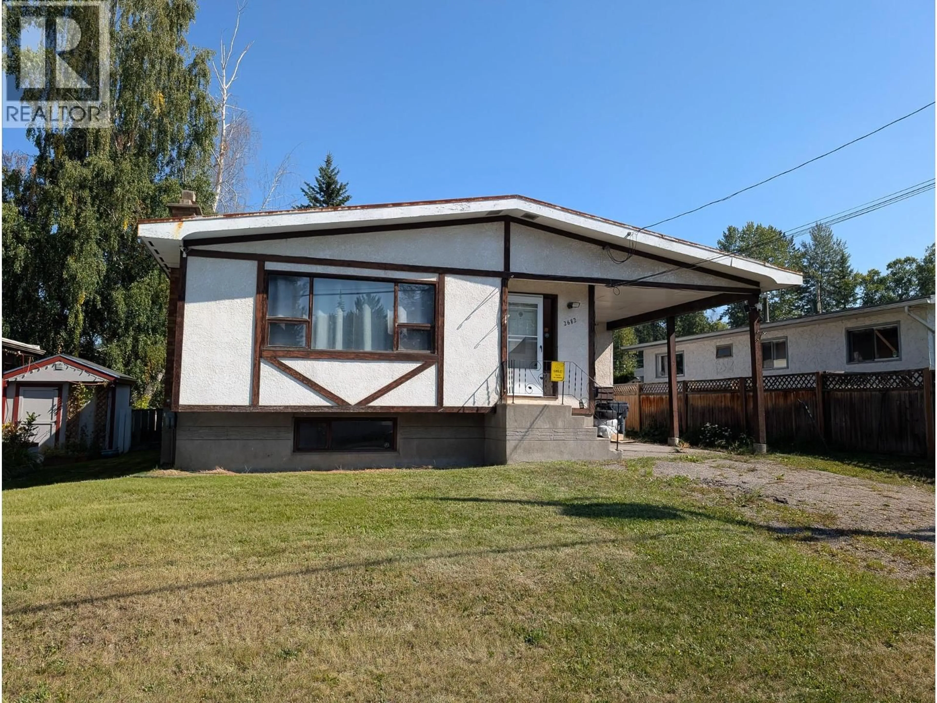 Home with vinyl exterior material, street for 2682 OAK STREET, Prince George British Columbia V2L5H3