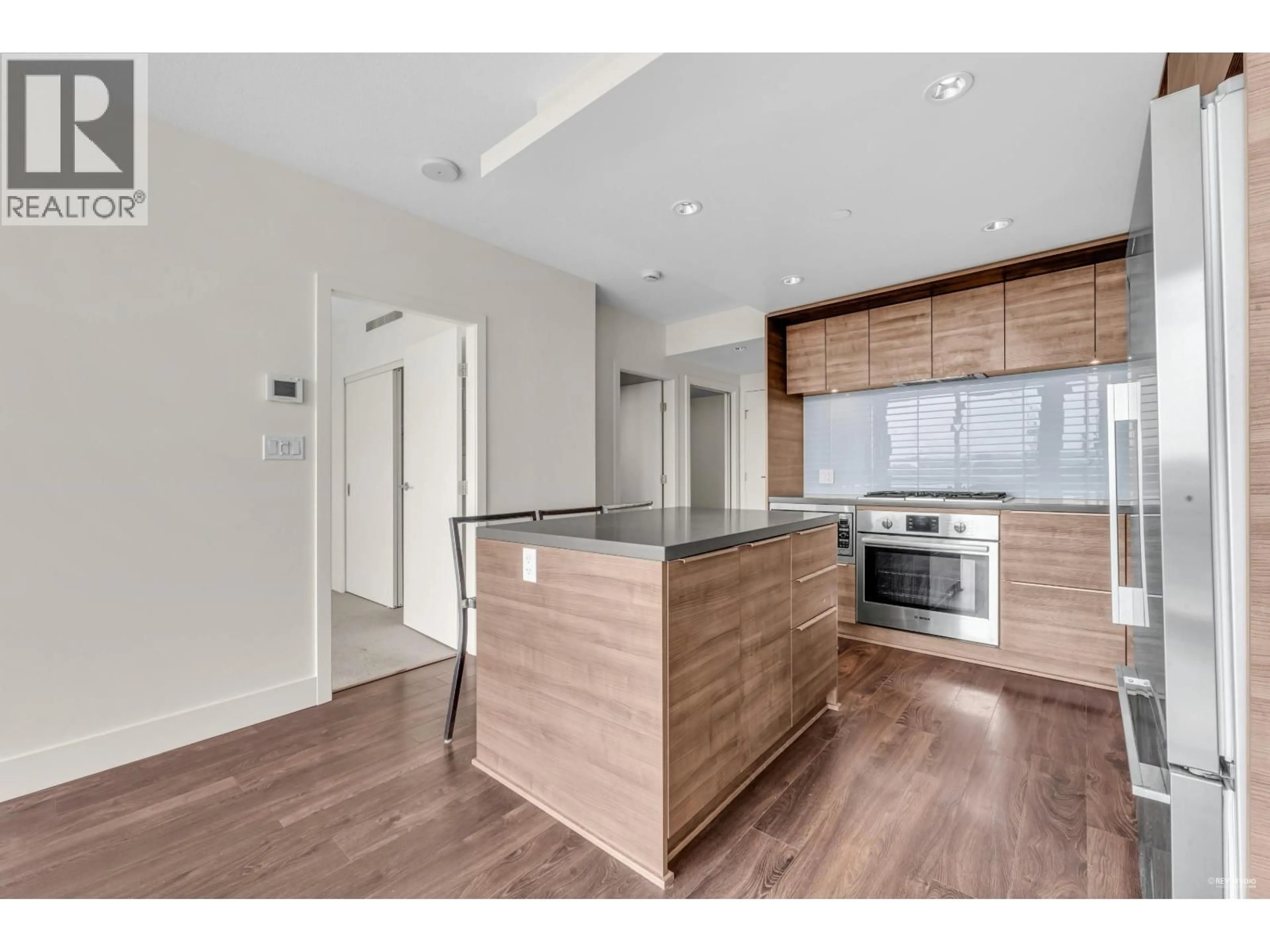 Open concept kitchen, wood/laminate floor for 1005 - 1550 FERN STREET, North Vancouver British Columbia V7J0A9