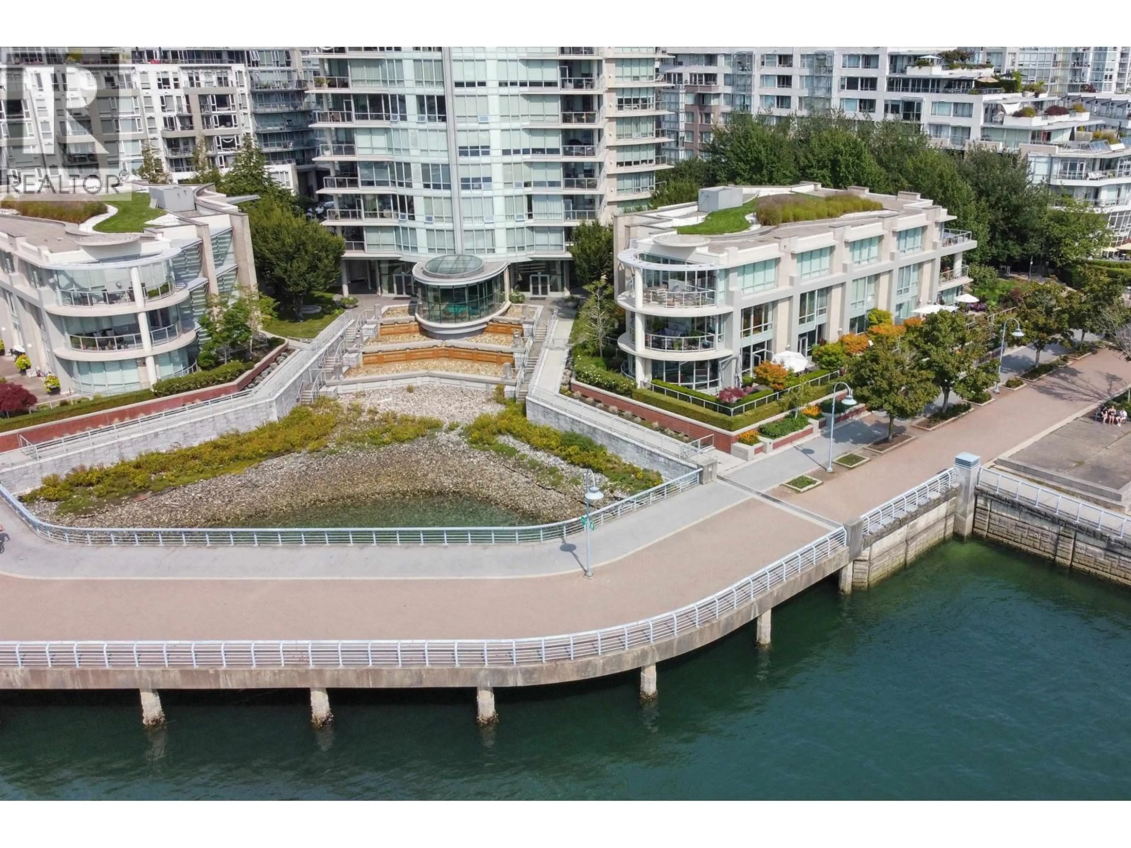 A pic from outside/outdoor area/front of a property/back of a property/a pic from drone, water/lake/river/ocean view for 110 - 1328 MARINASIDE CRESCENT, Vancouver British Columbia V6Z3B3