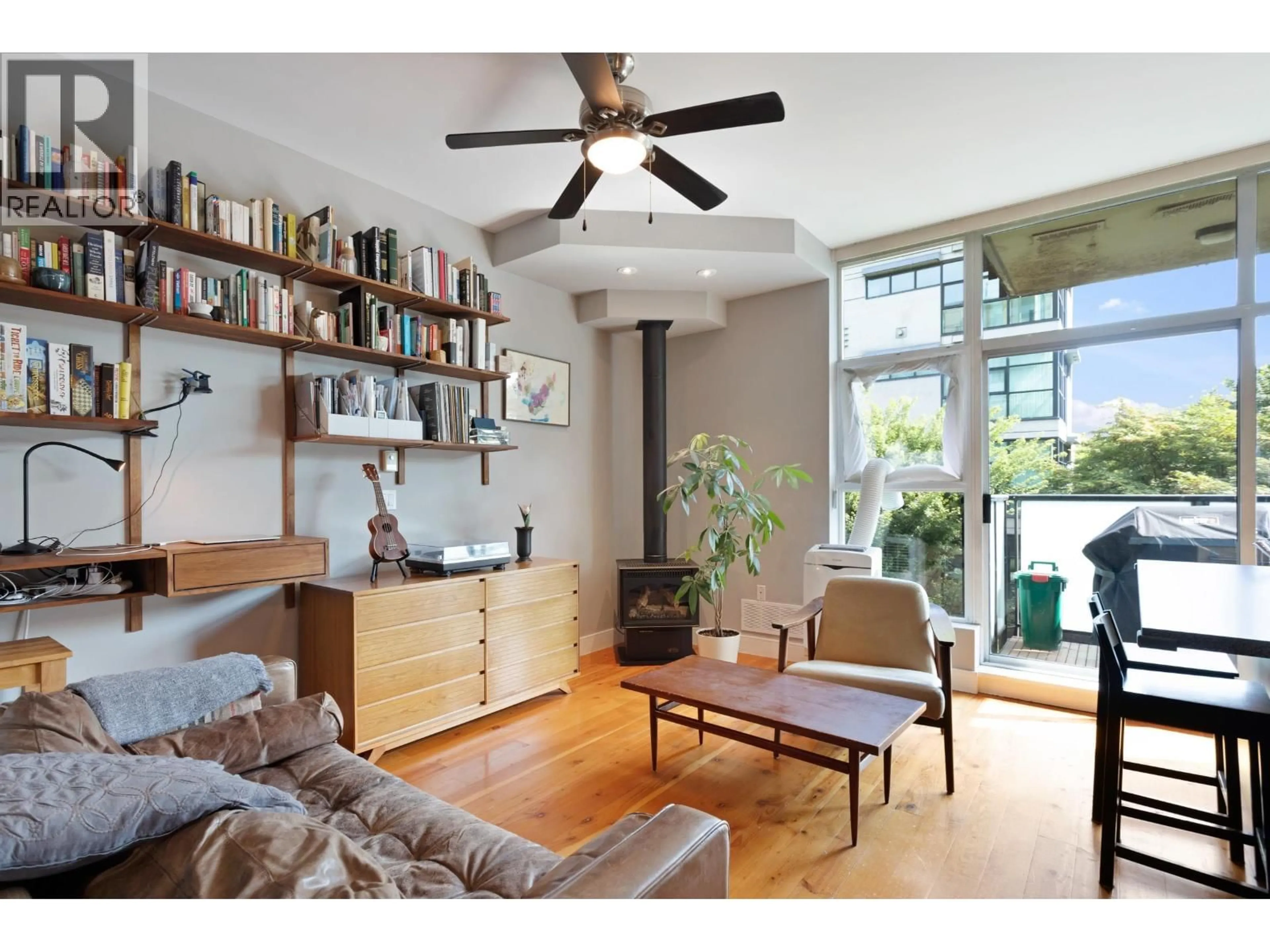 Living room with furniture, wood/laminate floor for 213 - 8988 HUDSON STREET, Vancouver British Columbia V6P6Z1