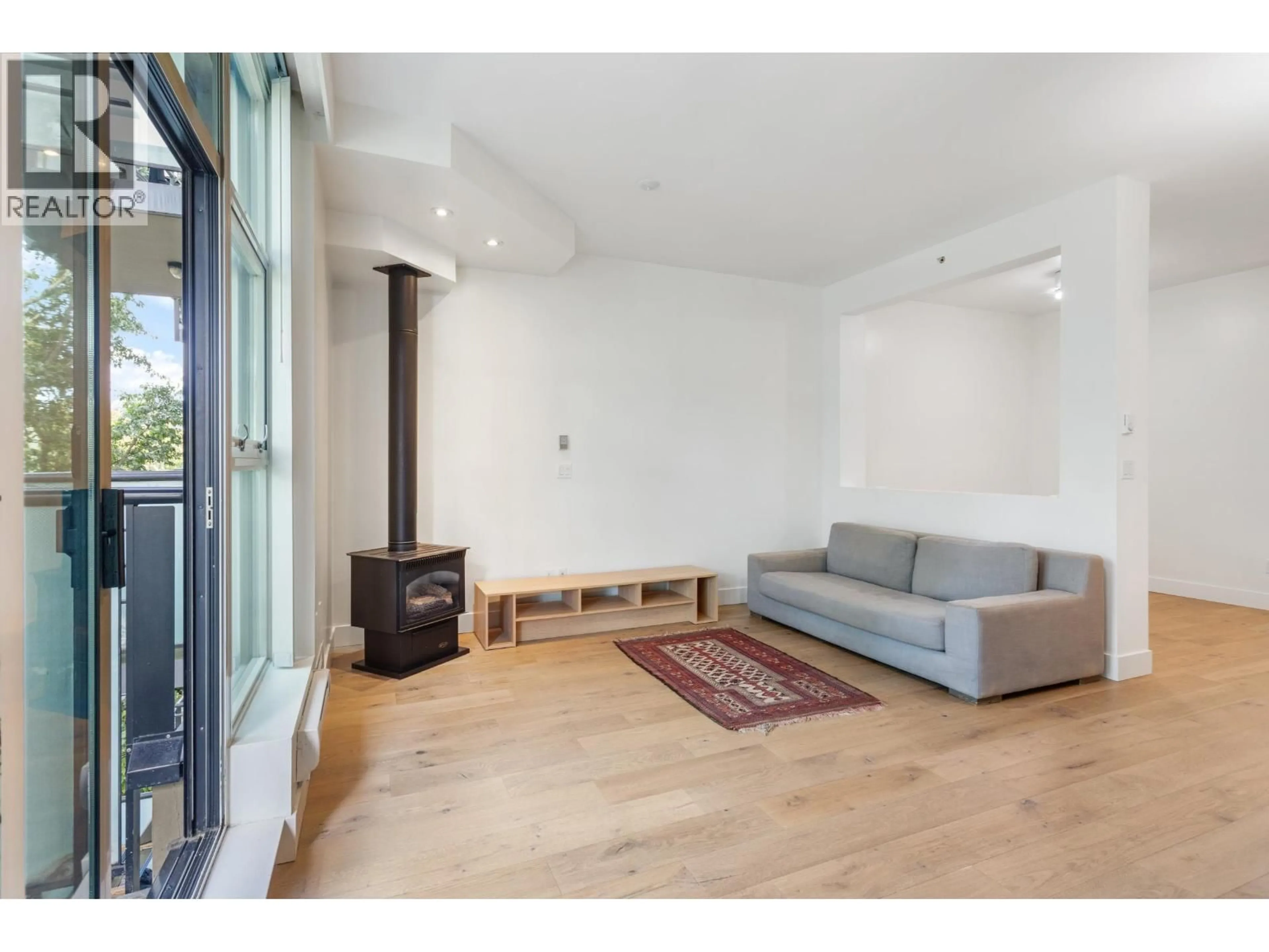 Living room with furniture, wood/laminate floor for 307 - 8988 HUDSON STREET, Vancouver British Columbia V6P6Z1