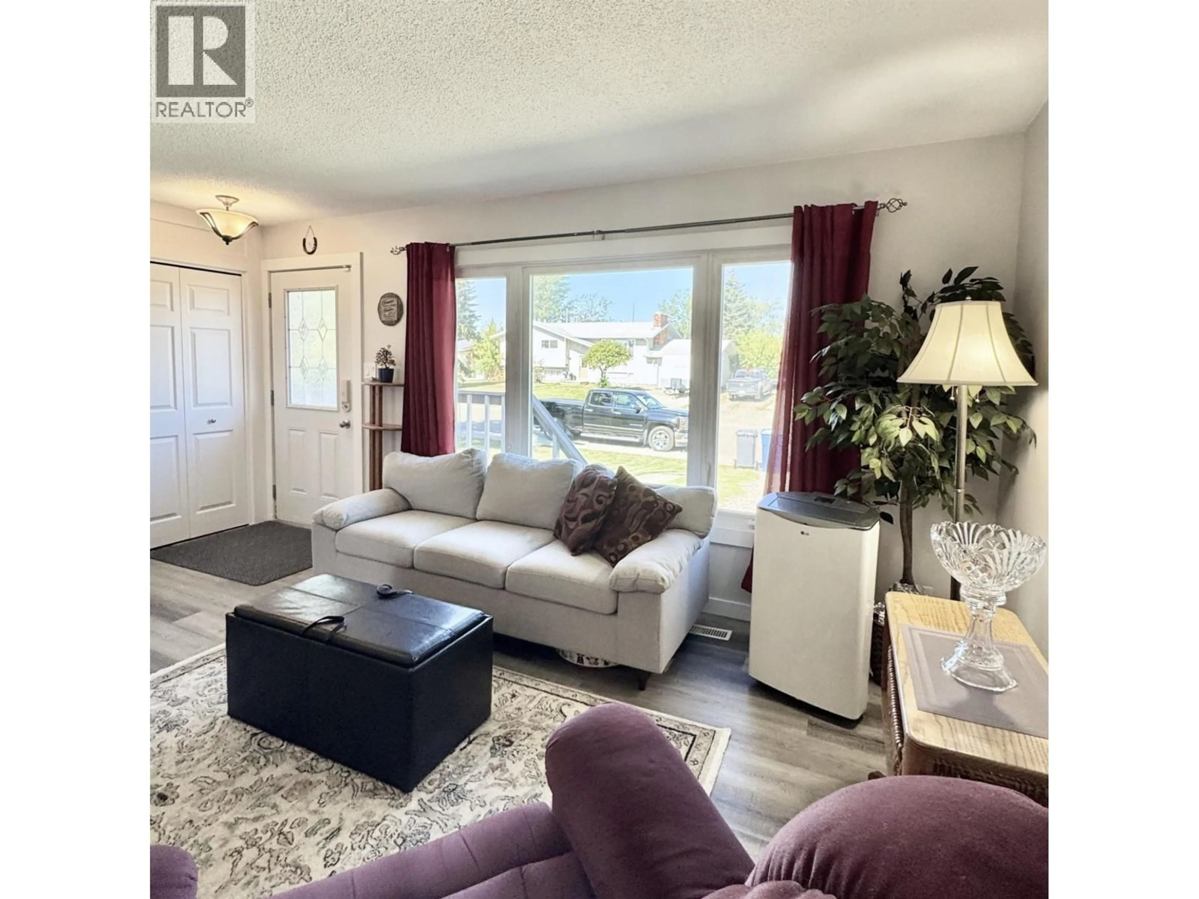 Living room with furniture, unknown for 8219 98 AVENUE, Fort St. John British Columbia V1J1P4