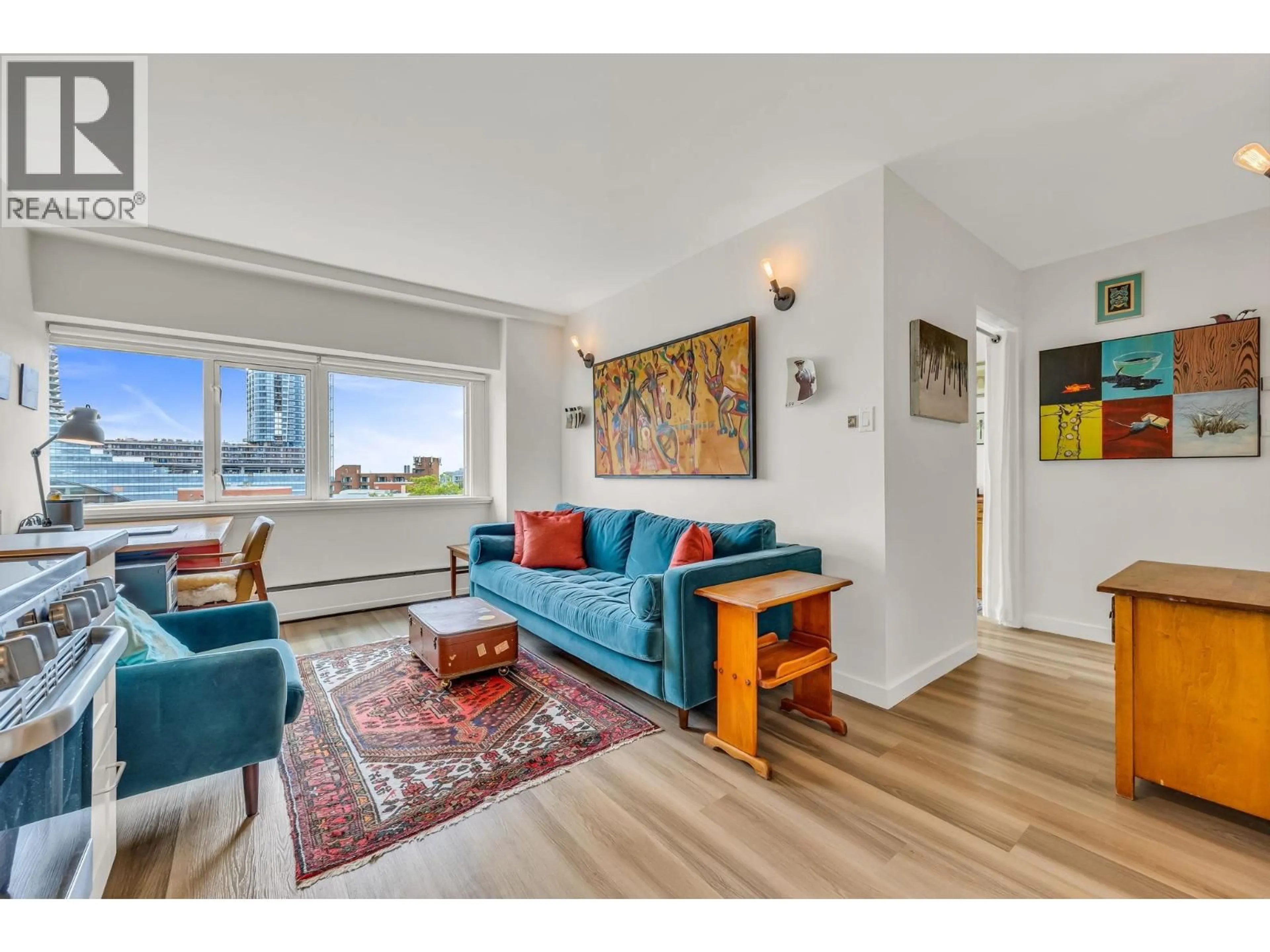 Living room with furniture, wood/laminate floor for 701 - 6026 TISDALL STREET, Vancouver British Columbia V5Z3N2