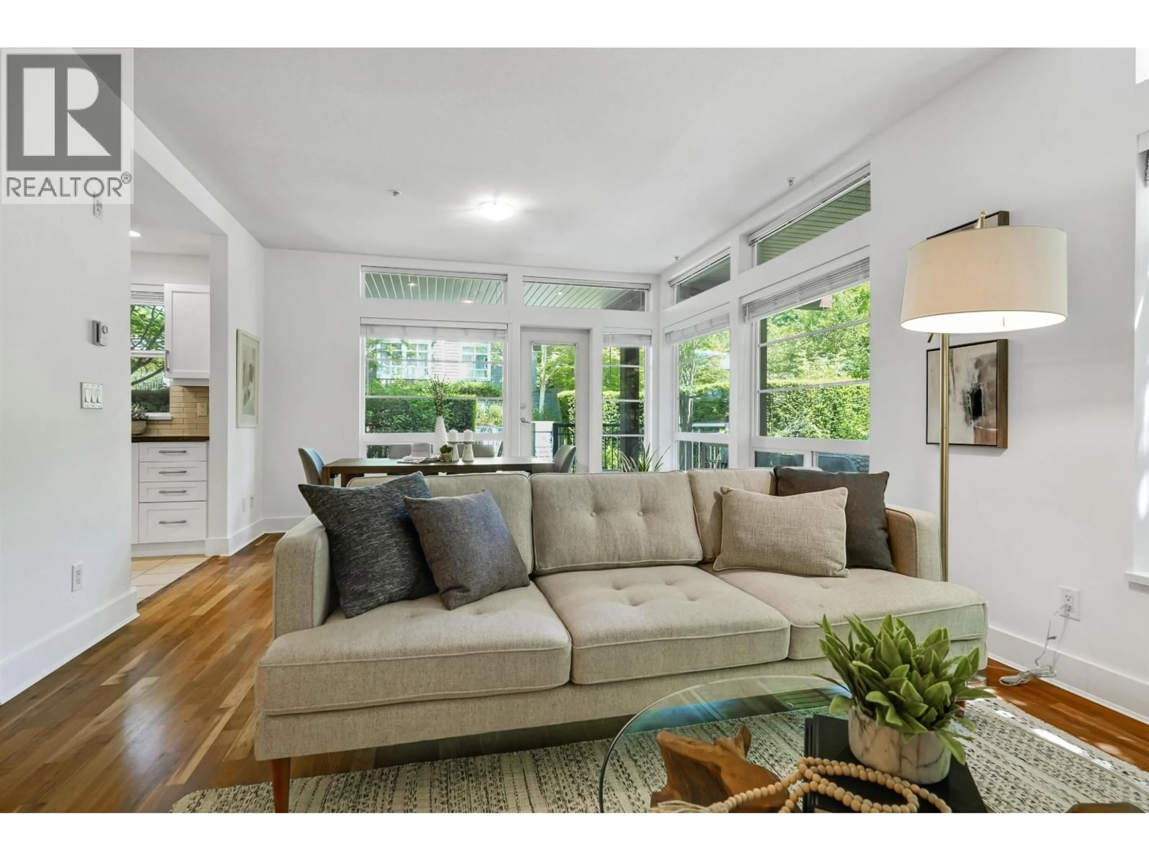 Living room with furniture, wood/laminate floor for 106 - 6328 LARKIN DRIVE, Vancouver British Columbia V6T2K2