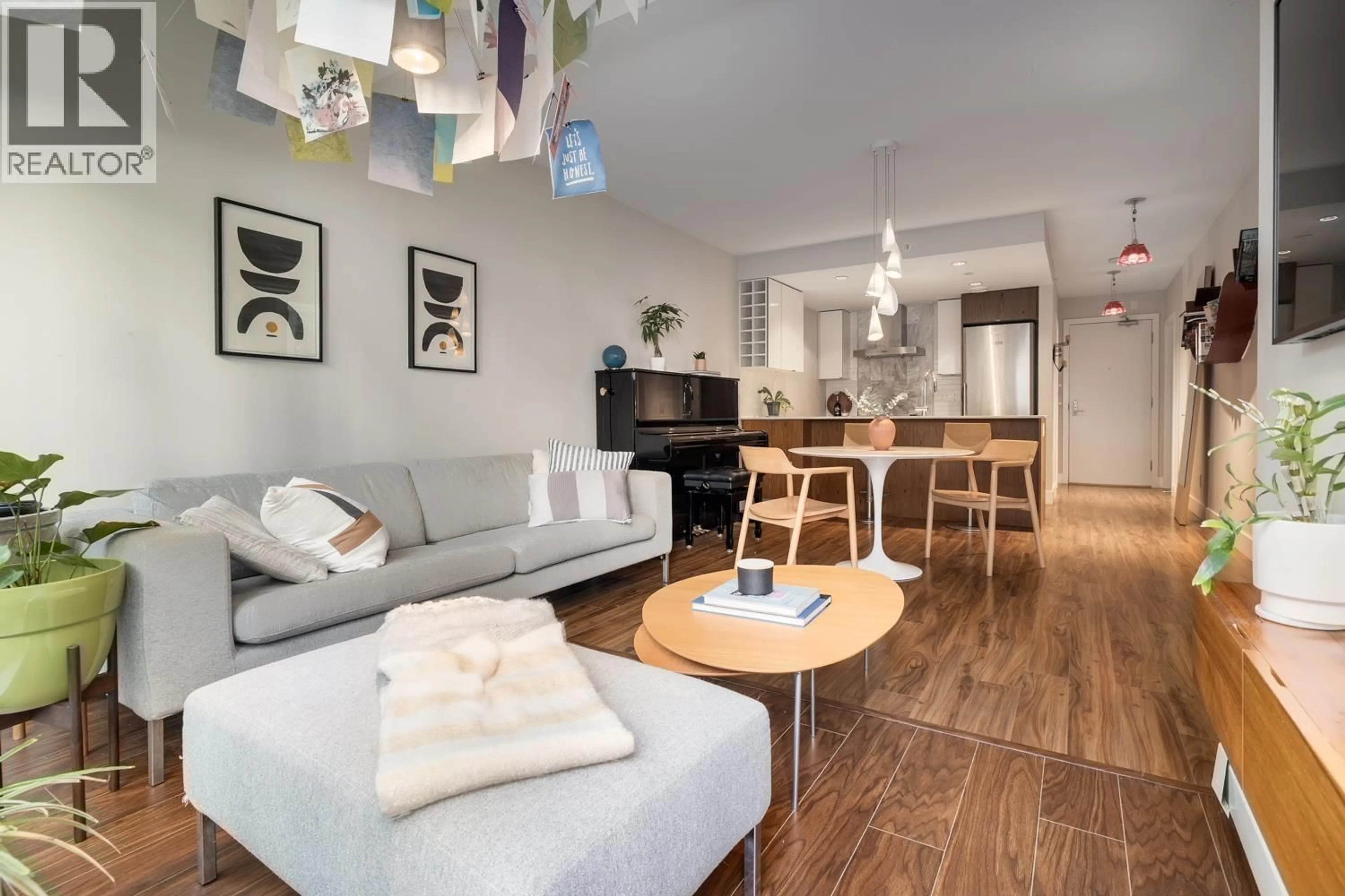 Living room with furniture, wood/laminate floor for 218 - 159 2ND AVENUE, Vancouver British Columbia V5Y0L8