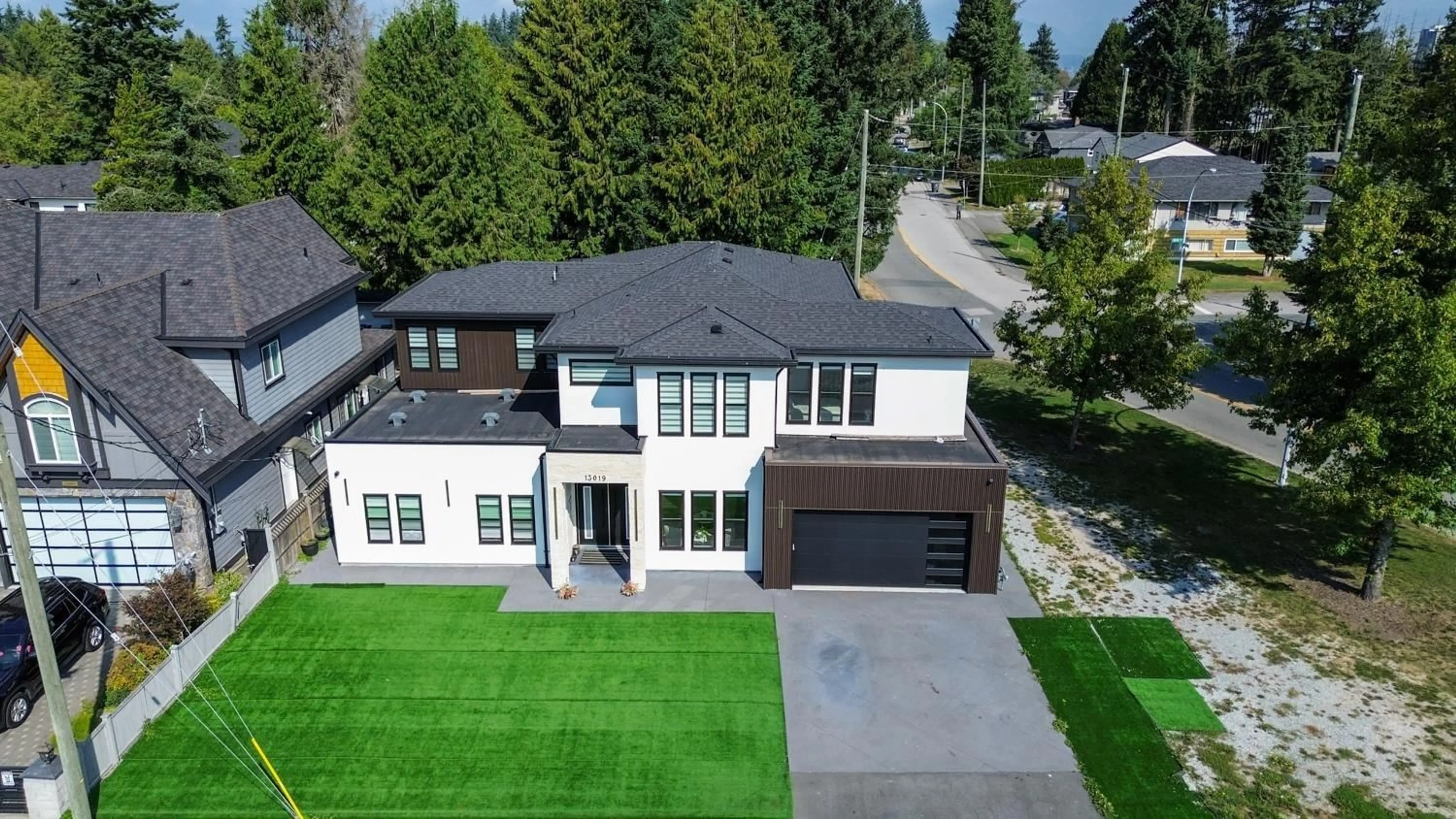 A pic from outside/outdoor area/front of a property/back of a property/a pic from drone, street for 13019 101A, Surrey British Columbia V3T1M3