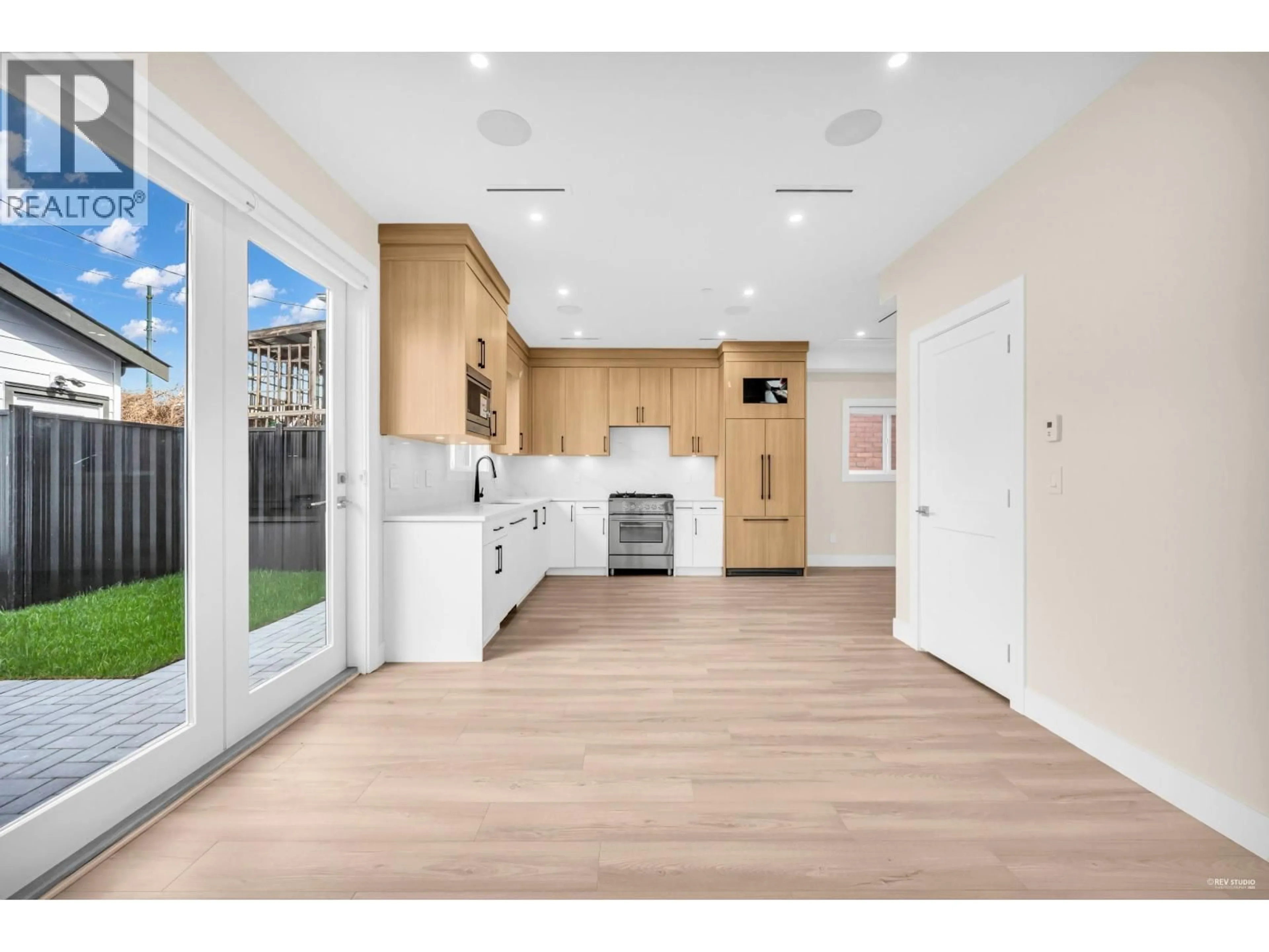 Open concept kitchen, wood/laminate floor for 2369 ADANAC STREET, Vancouver British Columbia V5L2E9