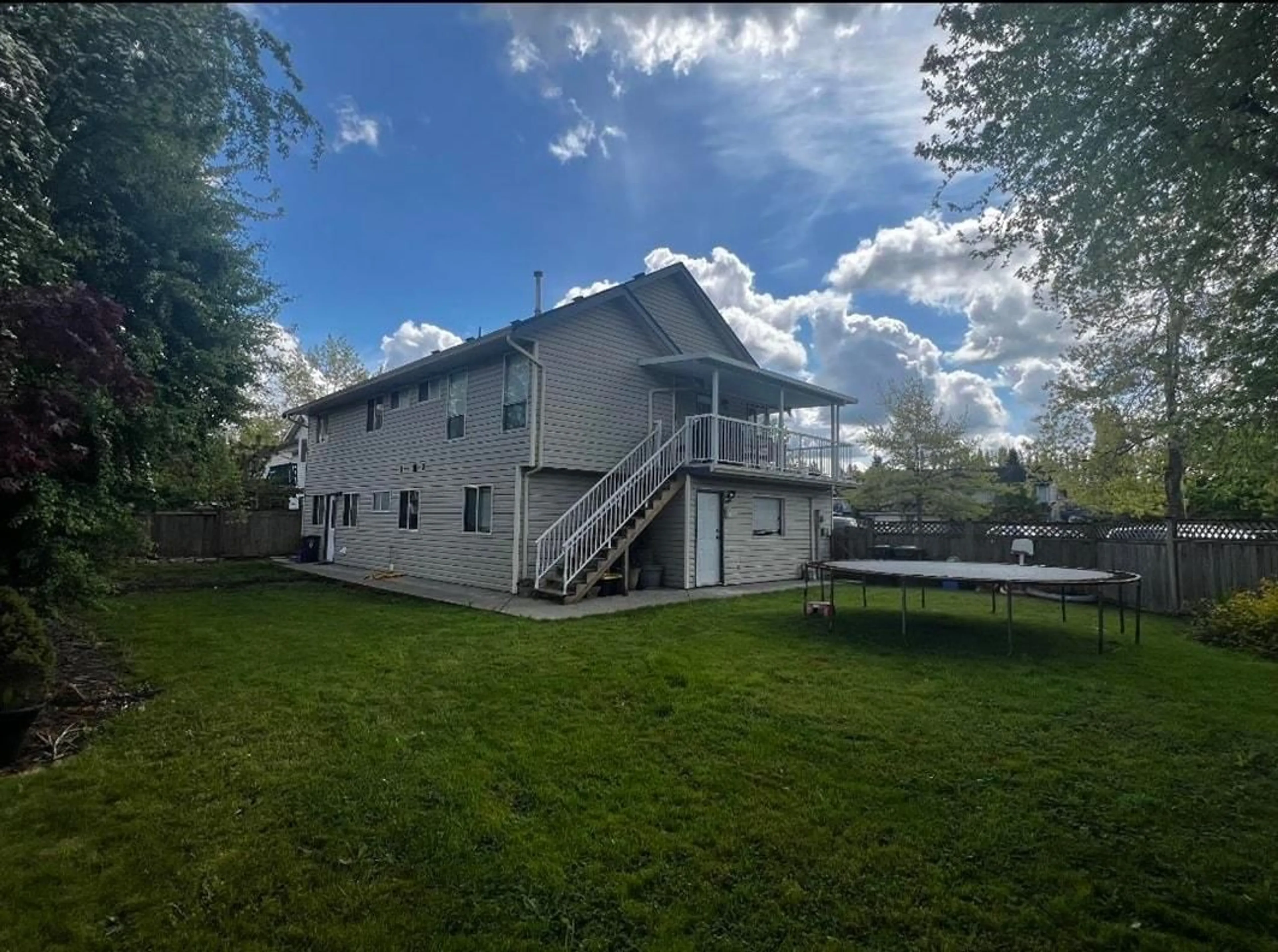 A pic from outside/outdoor area/front of a property/back of a property/a pic from drone, unknown for 21643 50A, Langley British Columbia V3A8W9