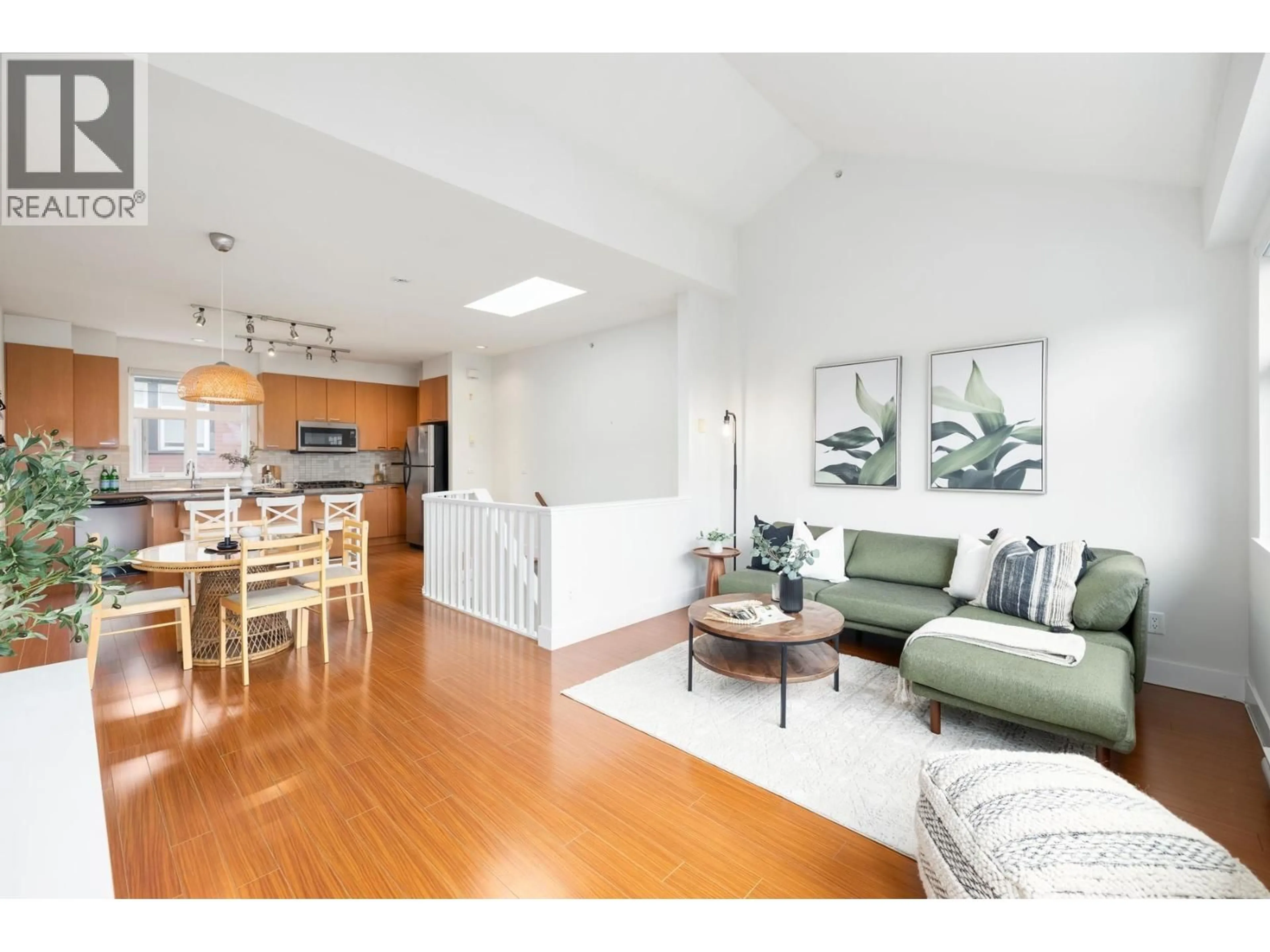 Living room with furniture, wood/laminate floor for 2276 ST. GEORGE STREET, Vancouver British Columbia V5T3R2