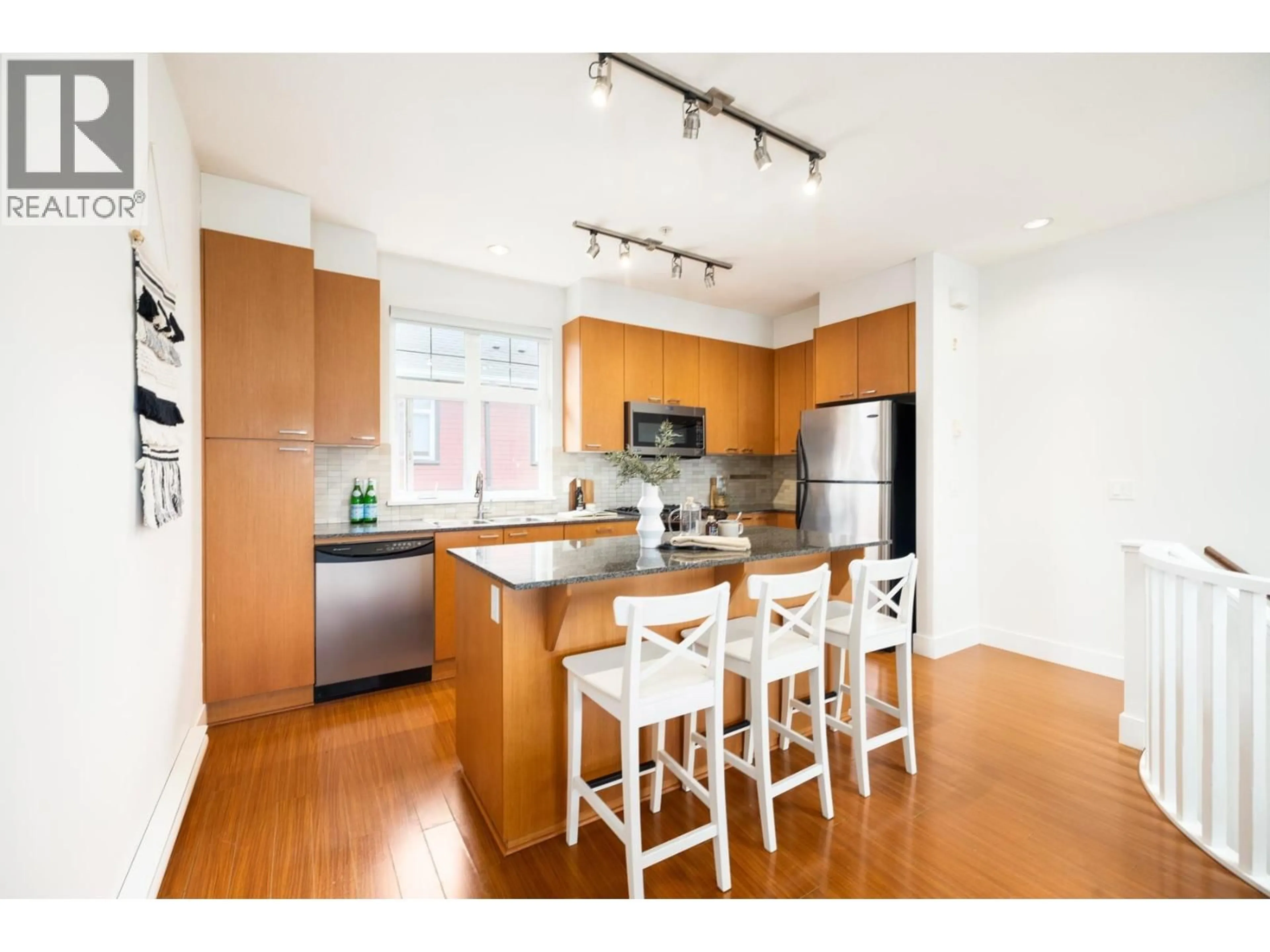 Open concept kitchen, wood/laminate floor for 2276 ST. GEORGE STREET, Vancouver British Columbia V5T3R2