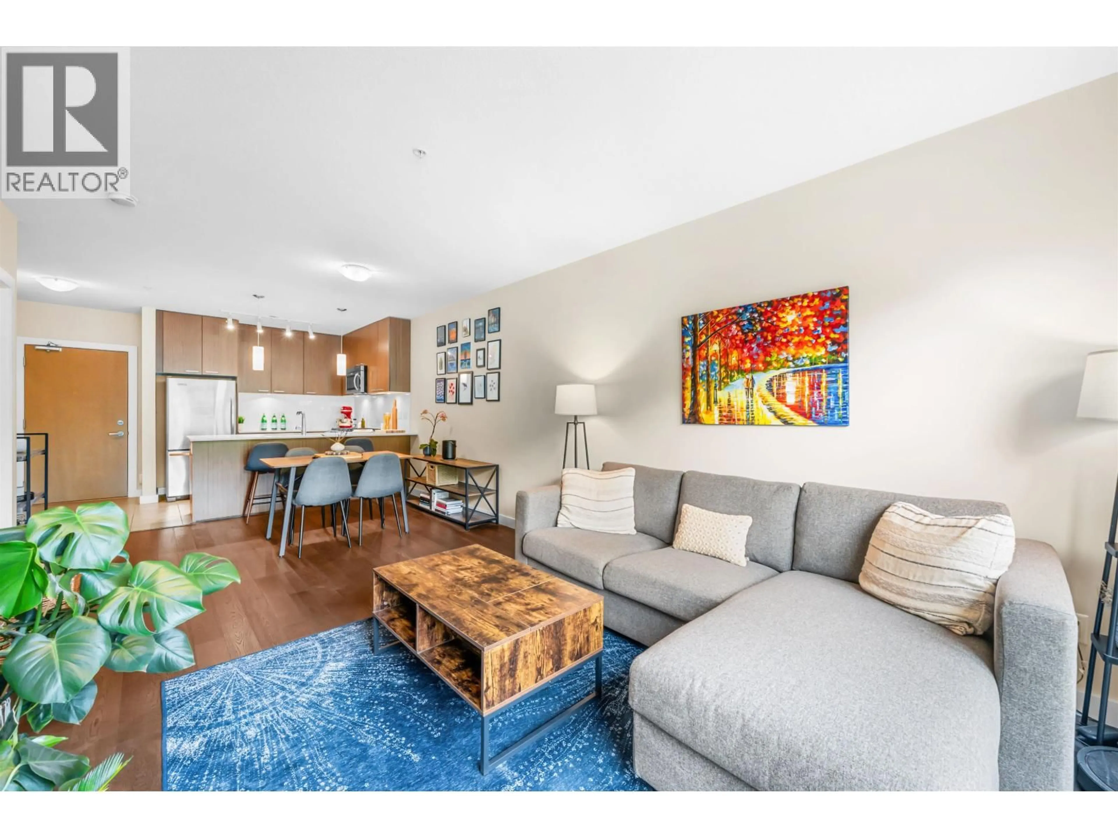 Living room with furniture, wood/laminate floor for 215 - 1330 MARINE DRIVE, North Vancouver British Columbia V7P1T4