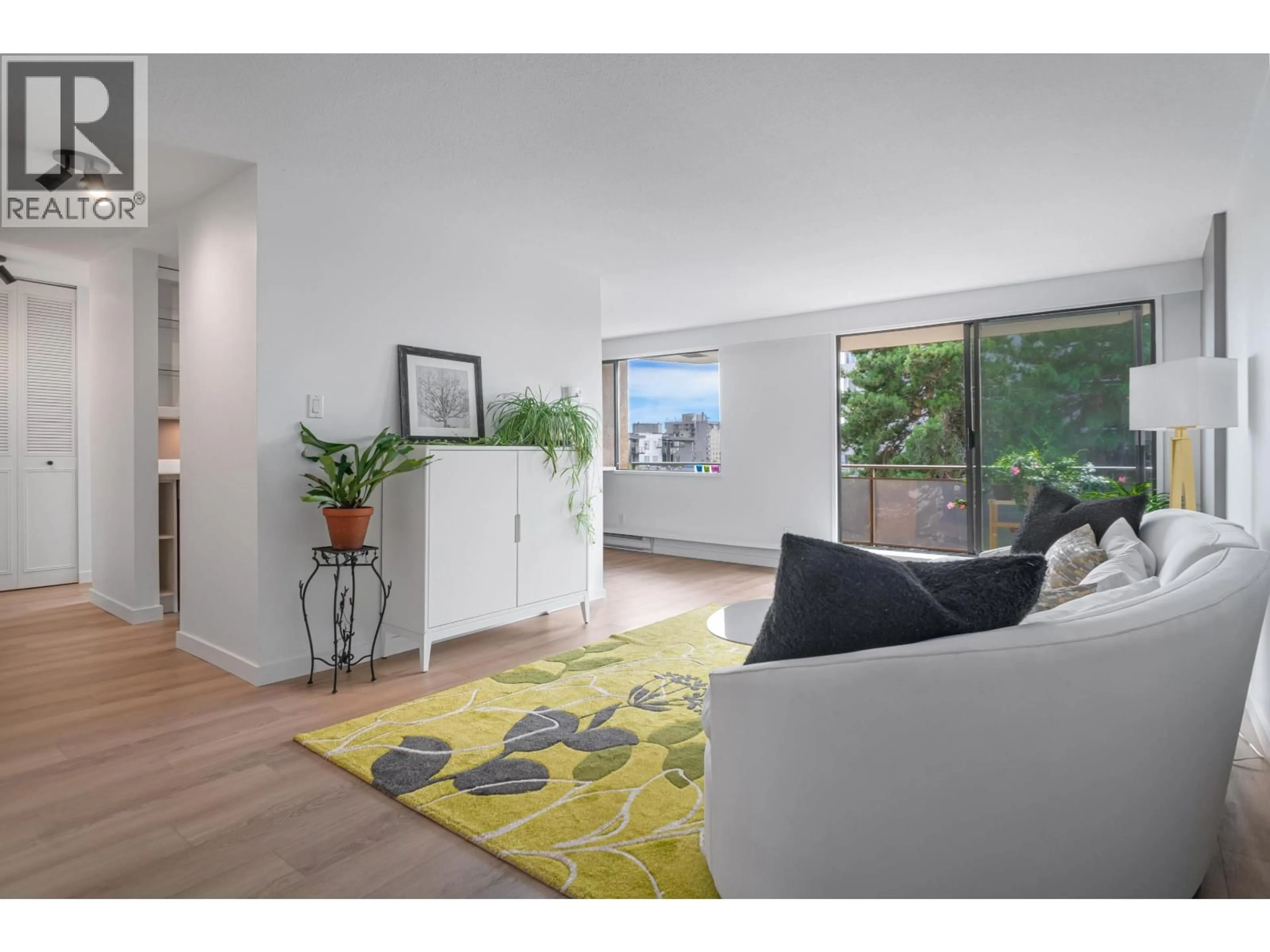 Living room with furniture, wood/laminate floor for 303 - 444 LONSDALE AVENUE, North Vancouver British Columbia V7M3H5
