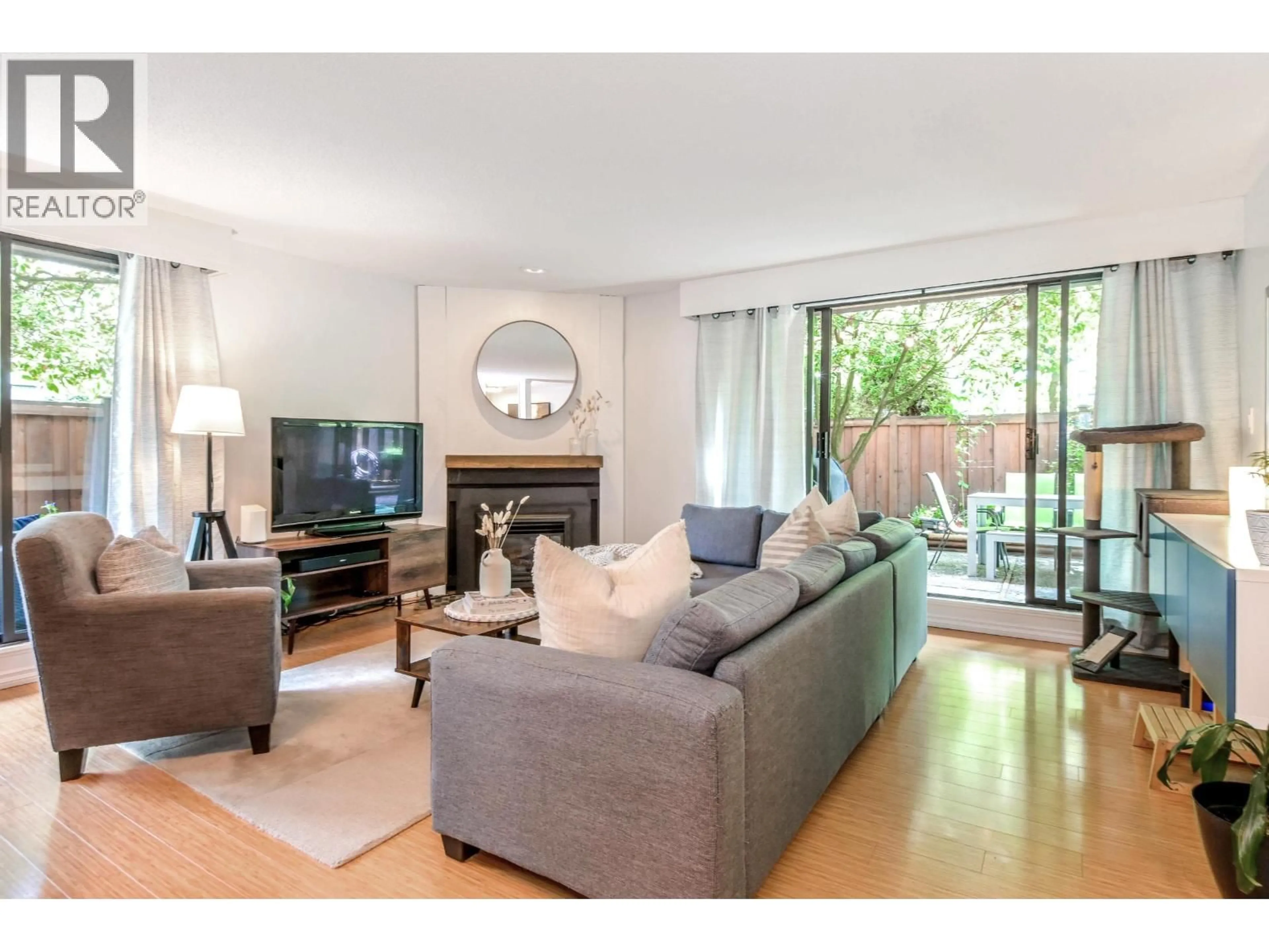 Living room with furniture, wood/laminate floor for 109 - 708 EIGHTH AVENUE, New Westminster British Columbia V3M2R3