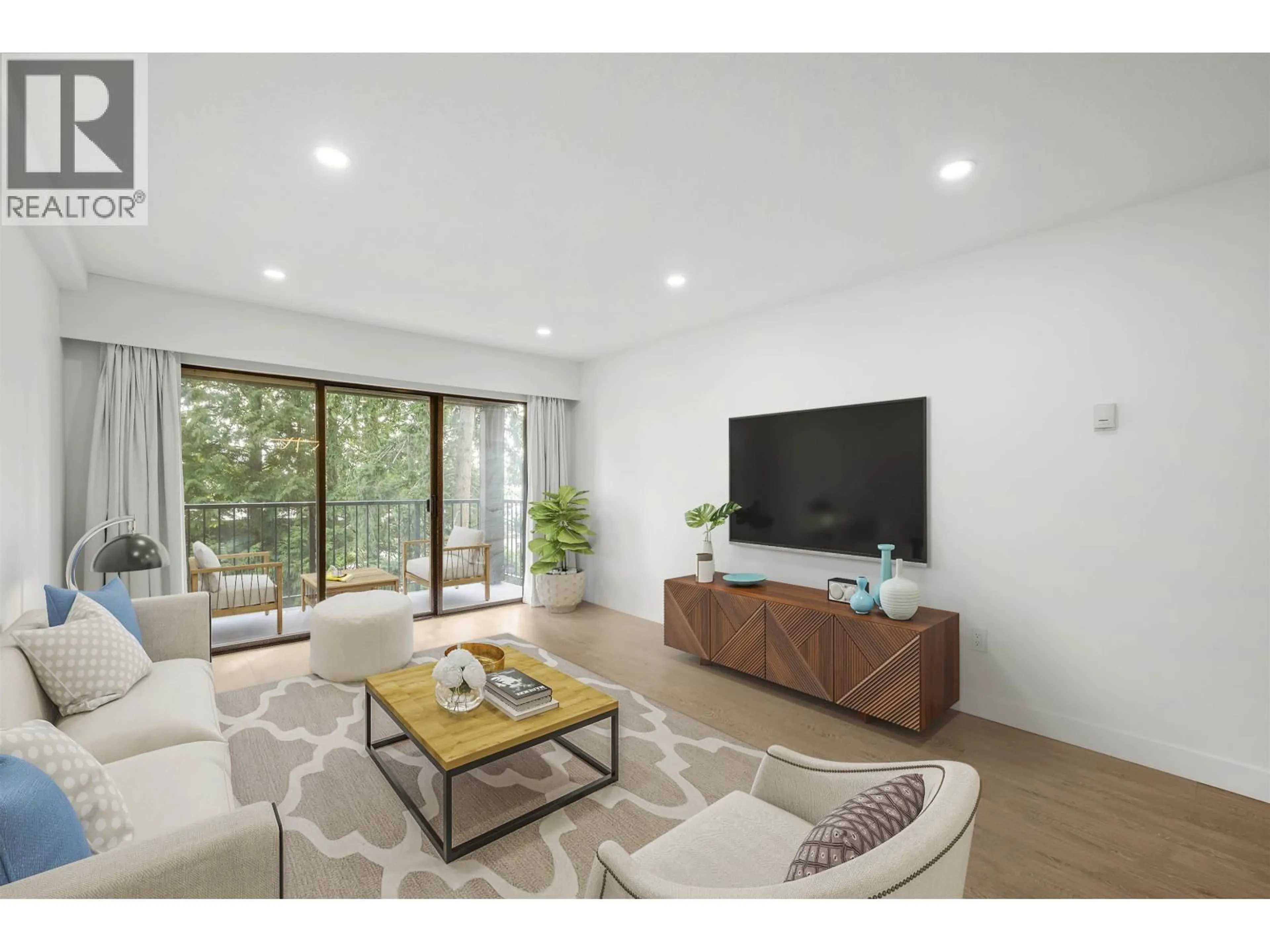 Living room with furniture, wood/laminate floor for 214 - 8860 NO. 1 ROAD, Richmond British Columbia V7C4C2