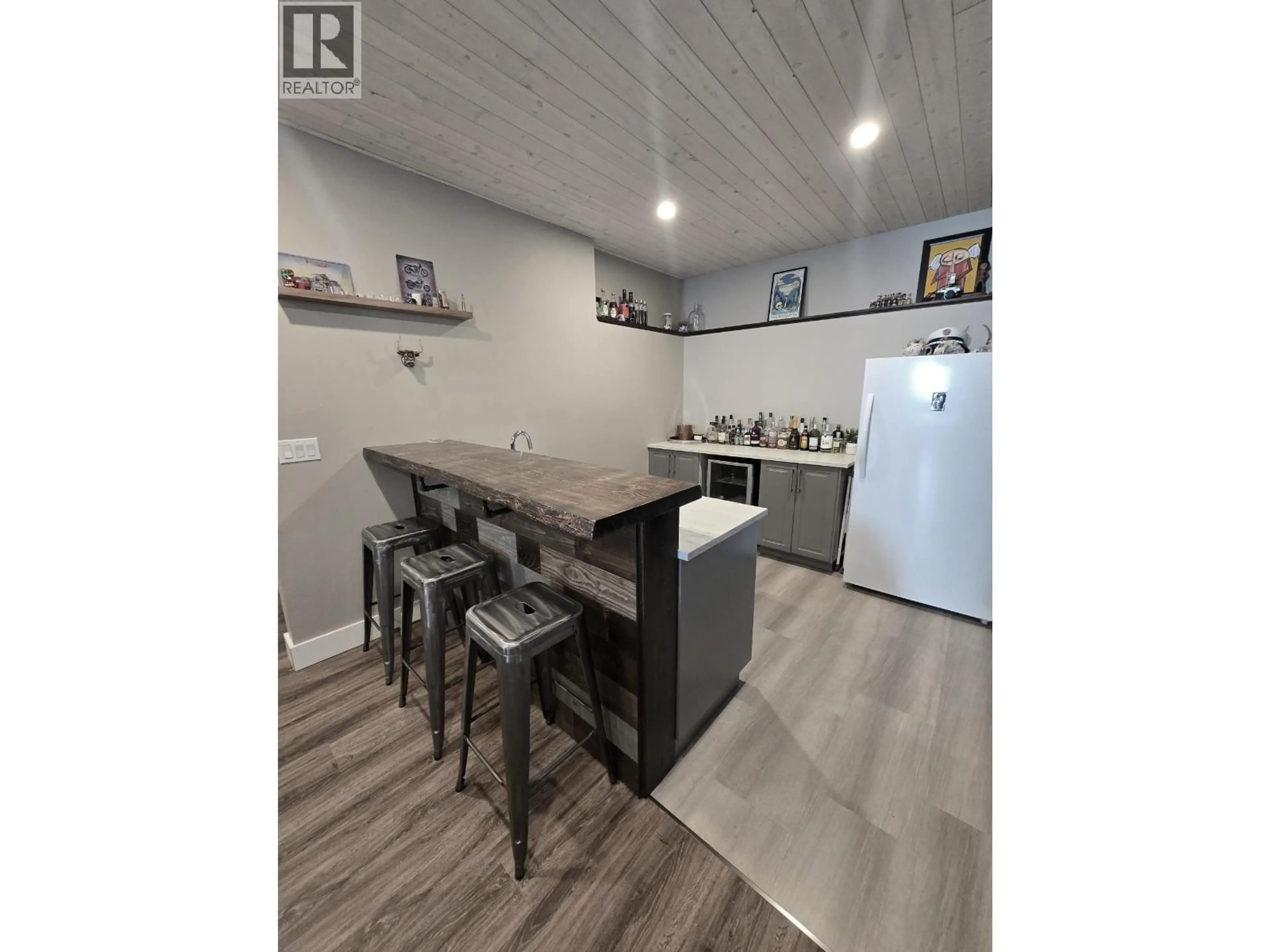 Open concept kitchen, wood/laminate floor for 11203 115 AVENUE, Fort St. John British Columbia V1J0N4