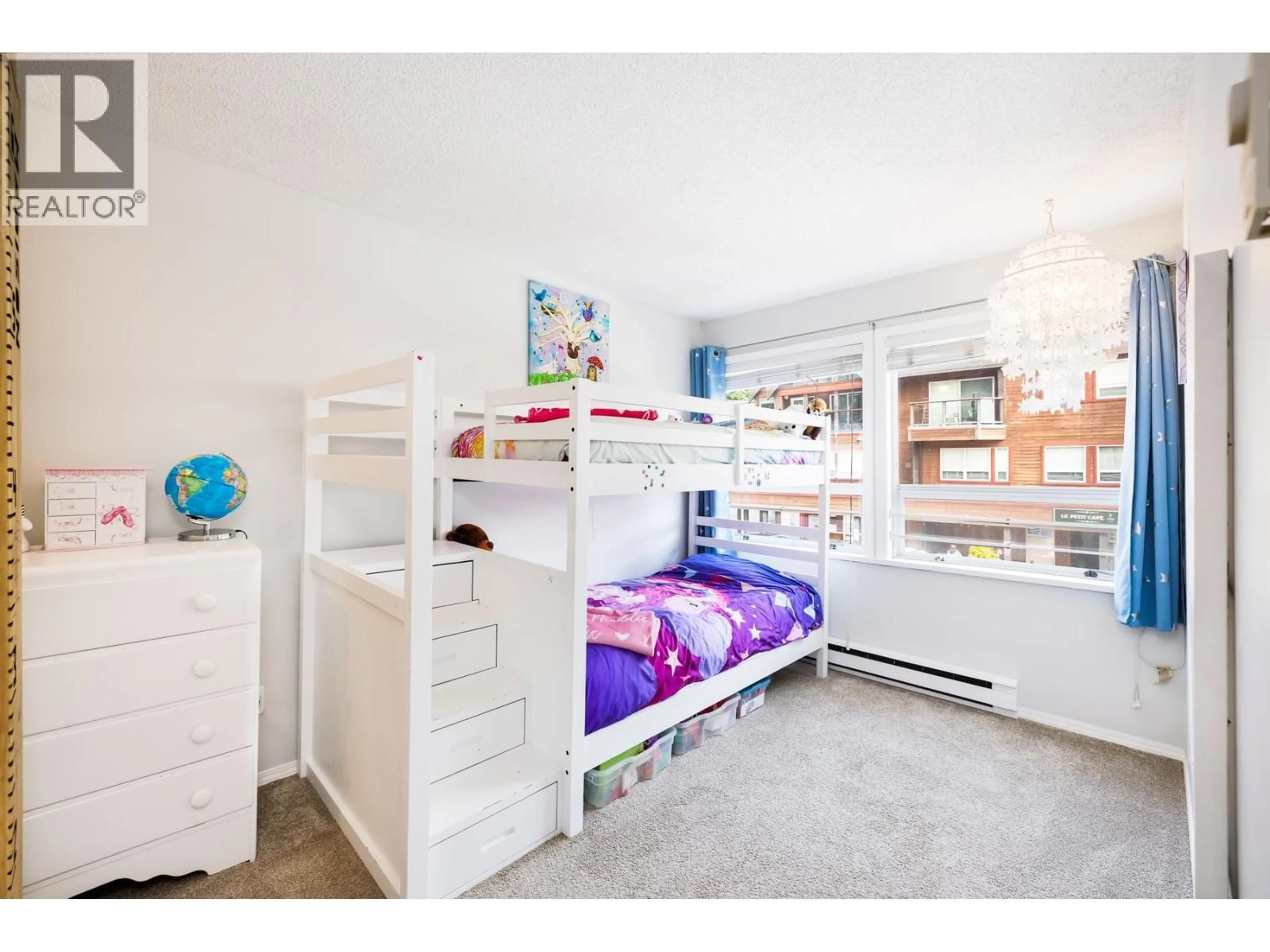 Bedroom with bed, wood/laminate floor for 309 - 3721 DELBROOK AVENUE, North Vancouver British Columbia V7N3Z4