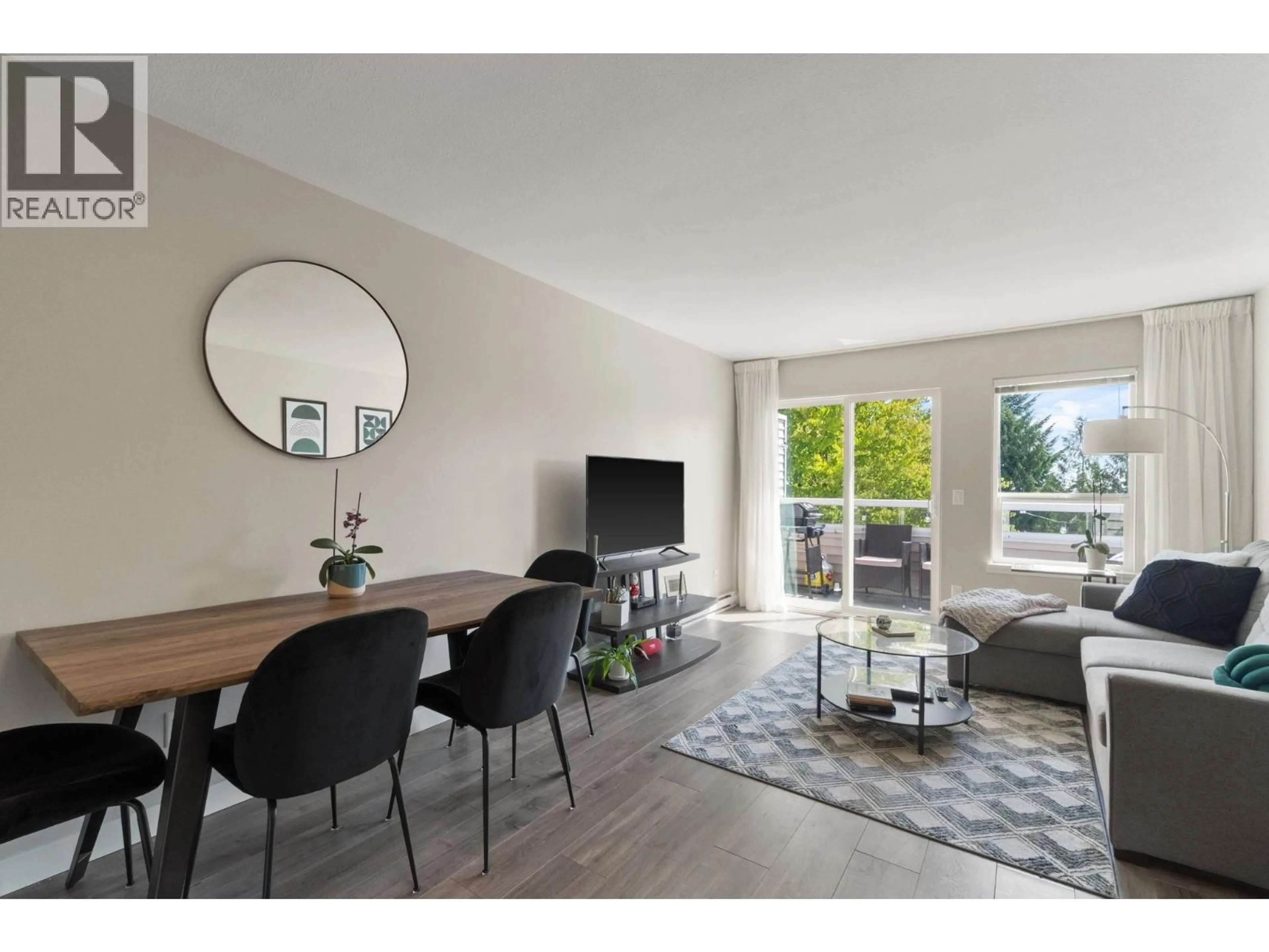 Living room with furniture, wood/laminate floor for 402 - 450 BROMLEY STREET, Coquitlam British Columbia V3K6S5