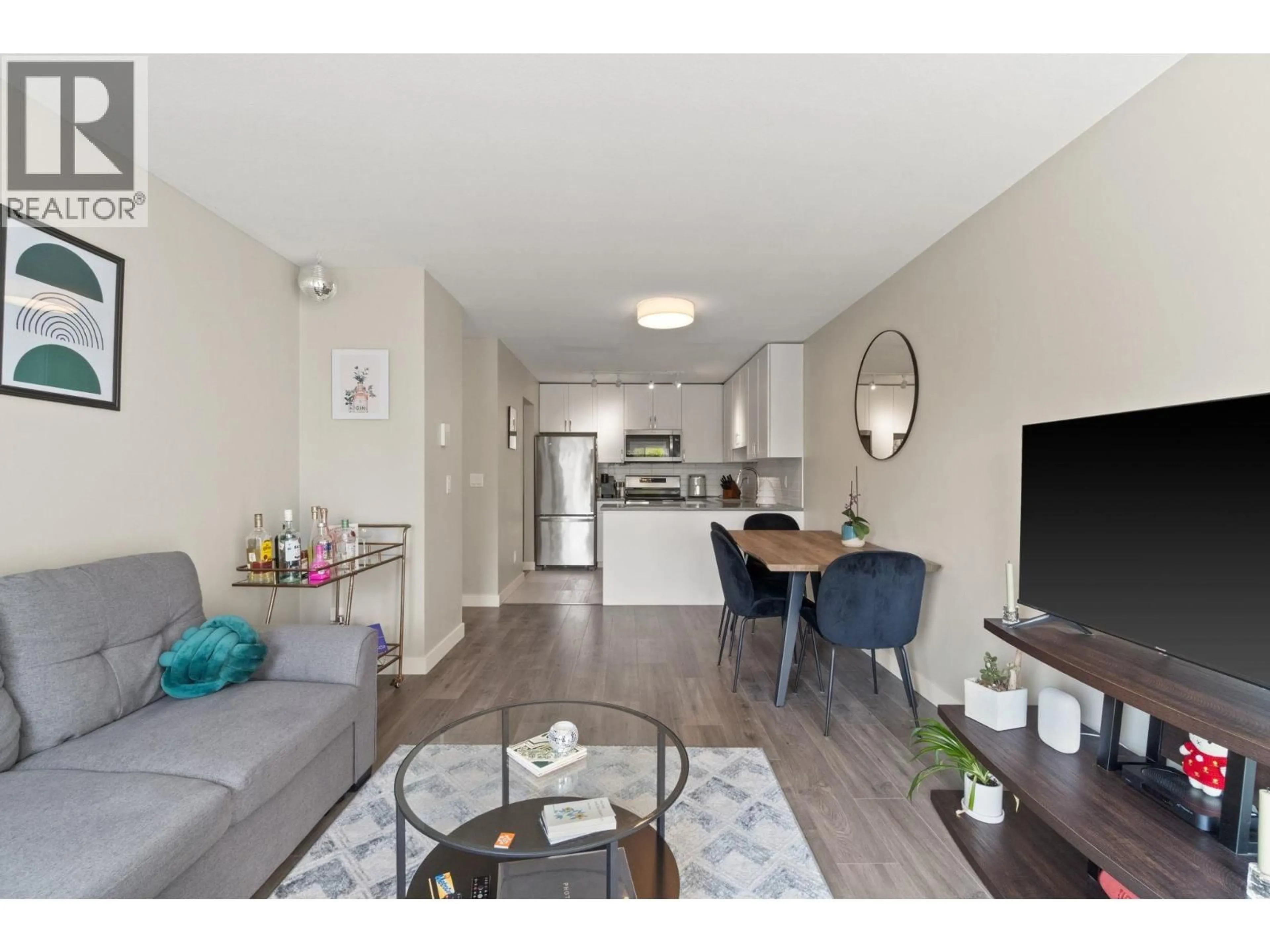 Living room with furniture, wood/laminate floor for 402 - 450 BROMLEY STREET, Coquitlam British Columbia V3K6S5
