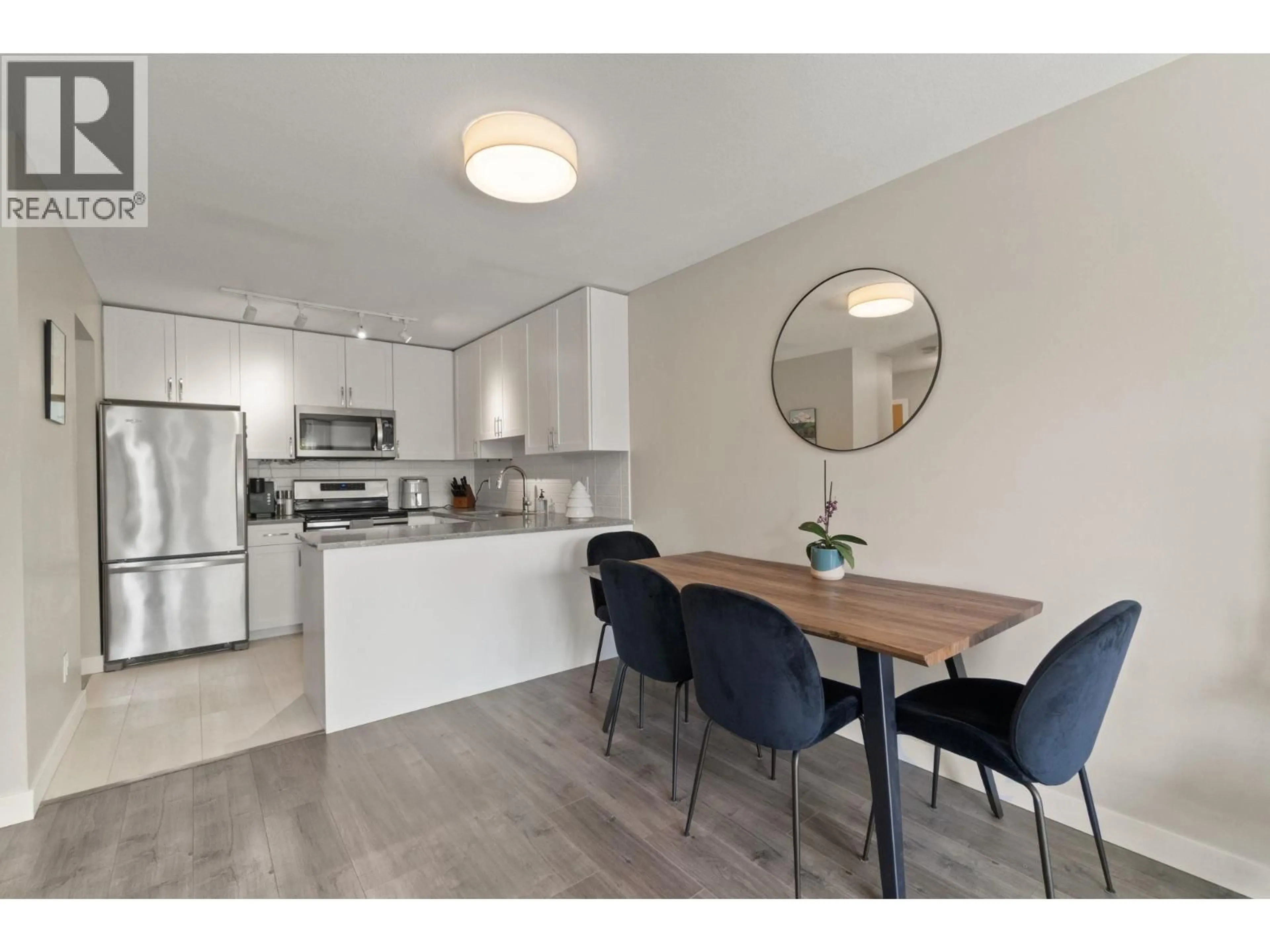 Open concept kitchen, wood/laminate floor for 402 - 450 BROMLEY STREET, Coquitlam British Columbia V3K6S5