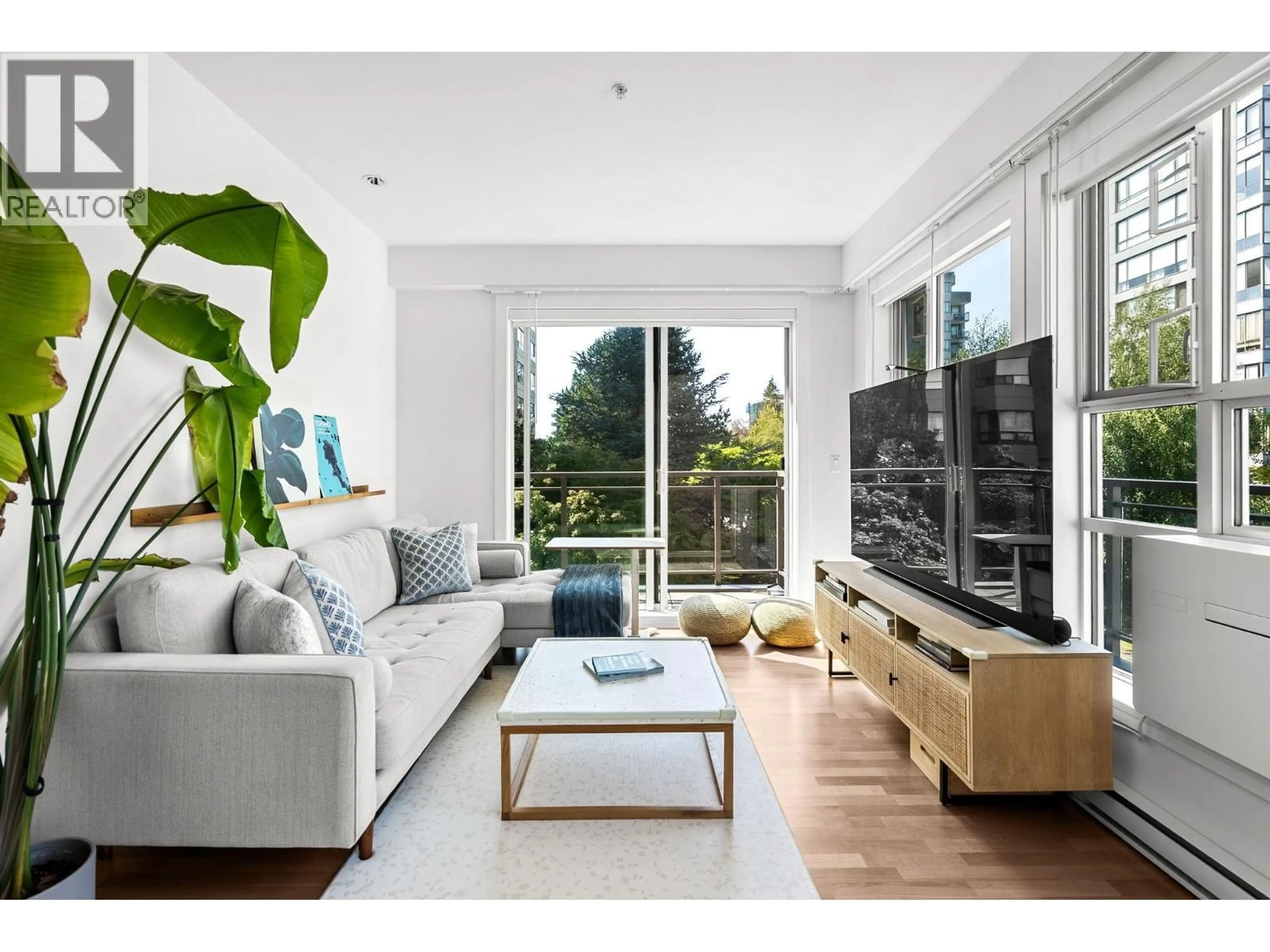Living room with furniture, wood/laminate floor for 306 - 2128 40TH AVENUE, Vancouver British Columbia V6M1W5