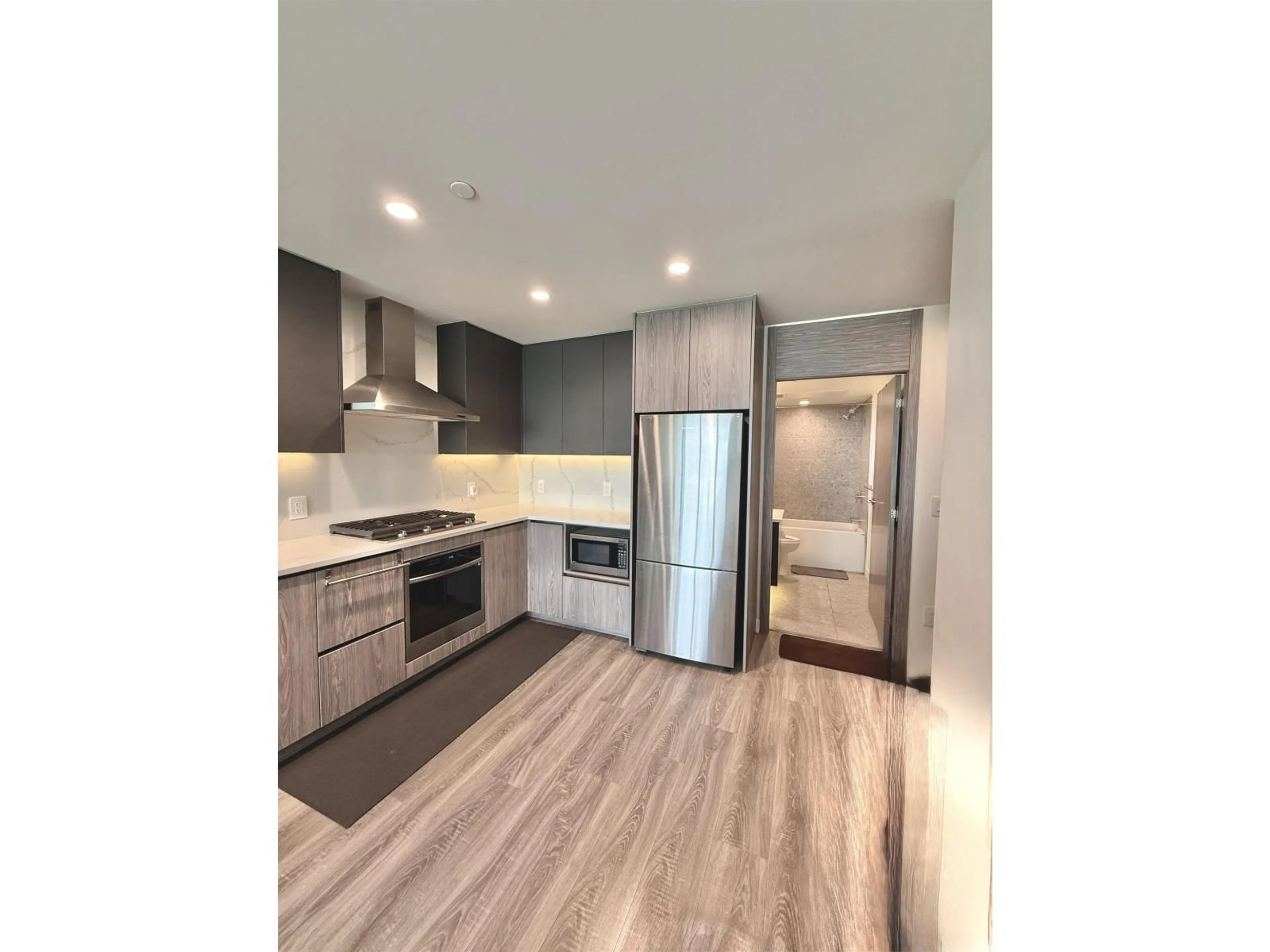 Open concept kitchen, wood/laminate floor for 1802 - 10750 135A, Surrey British Columbia V3T0V4